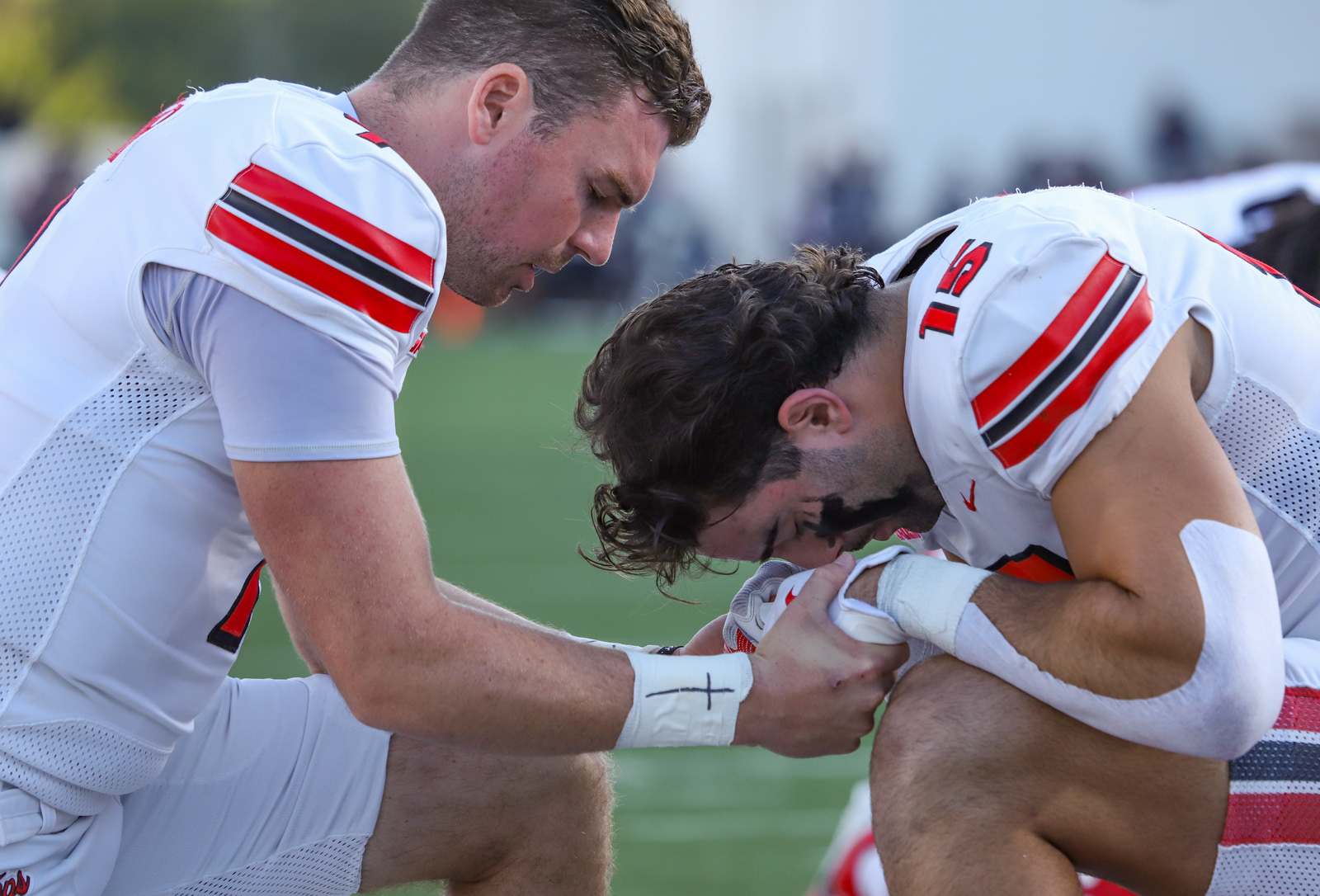 From left, Western Kentucky's quarterback Maverick McIvor and tight end  Justin Wolf pray before the game against Missouri State on Saturday, Sept. 27, 2025, in Springfield, MO. 