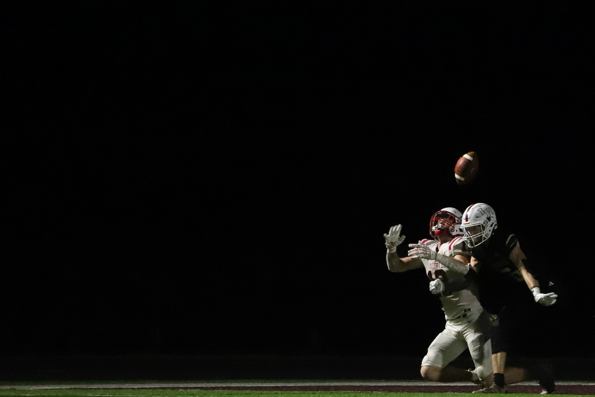 Logan-Rogersville defender Lucas White and West Plains wide receiver Jacob Moore fight for the ball on Friday, Sept. 26, 2025, in Rogersville, MO