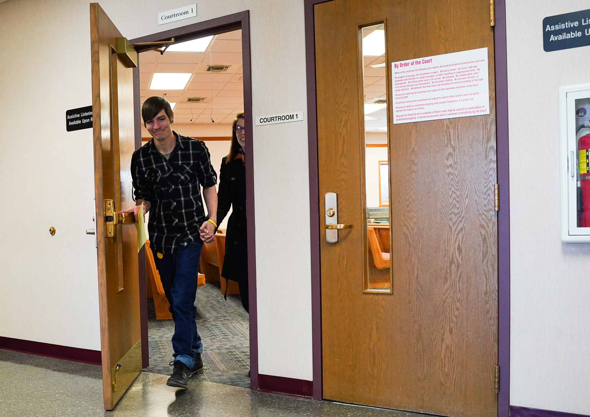 Dustin Hardcastle walks out of Judge John Beger’s courtroom with his fiance on Tuesday, March 18, 2025, in Rolla, Mo. After months of litigation by his attorney Lizzie DeJoie and the discussion Rowe’s mitigation memo with the prosecution, Hardcastle was given probation for his DUI case insetad of prison. With Rowe’s help, he succeded on bond while out of custody, found addiction treatment through sober living, found a job locally and is now engaged.