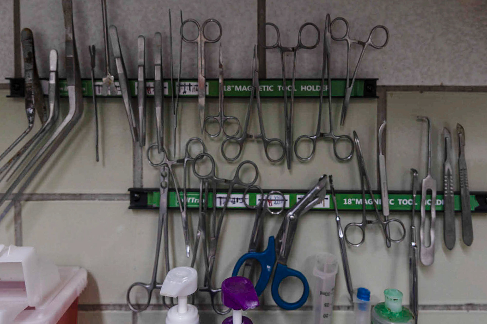 Surgical scissors hang against a wall at Hughes Funeral Home.