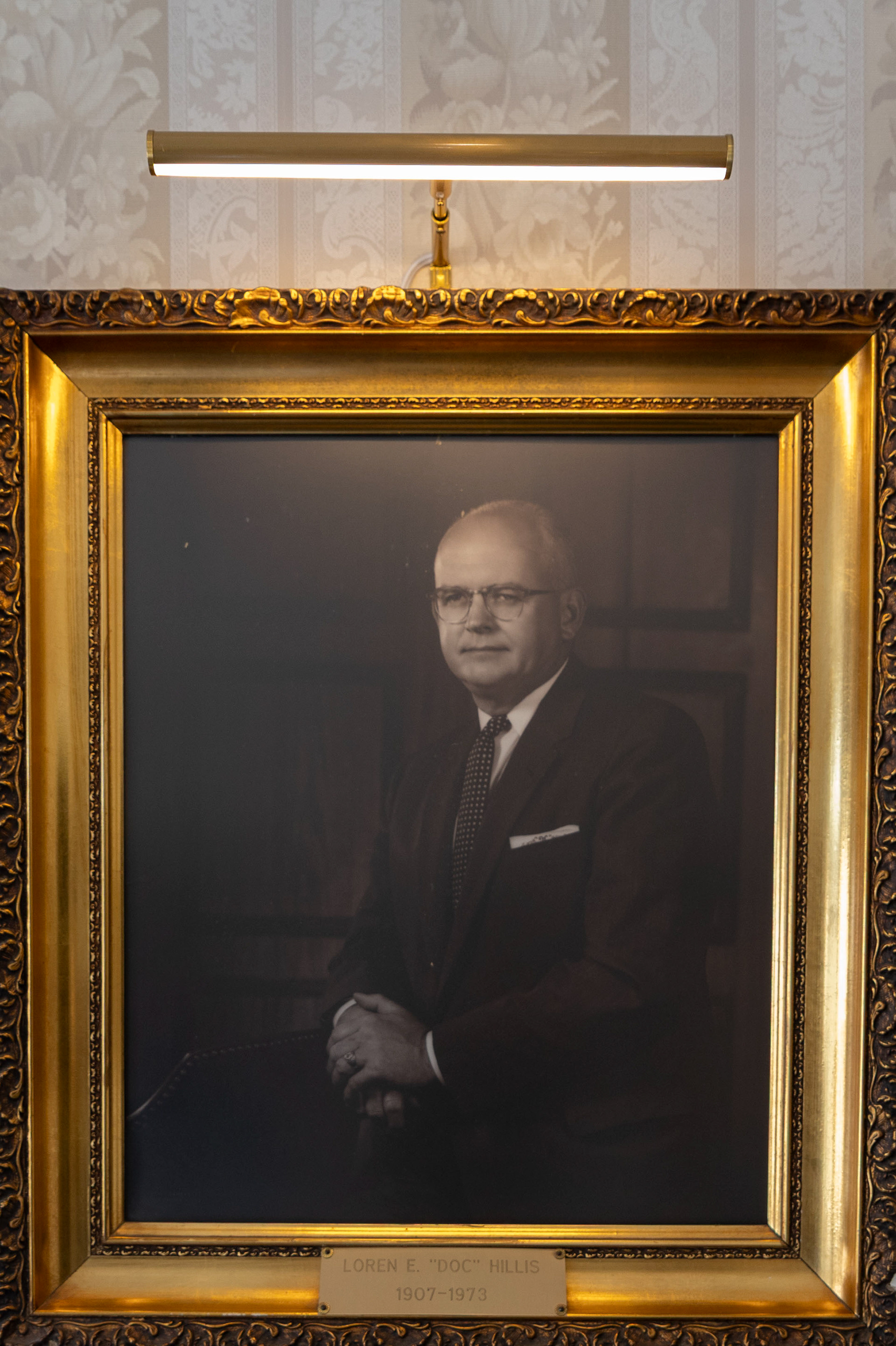 A portrait of Loren E. "Doc" Hillis hangs on the wall of the foyer in Hillis and Combs Funeral Home. Loren started Hillis Funeral Home in 1946 on 932 Maple Avenue before he purchased the current house in 1955, moving the business there.