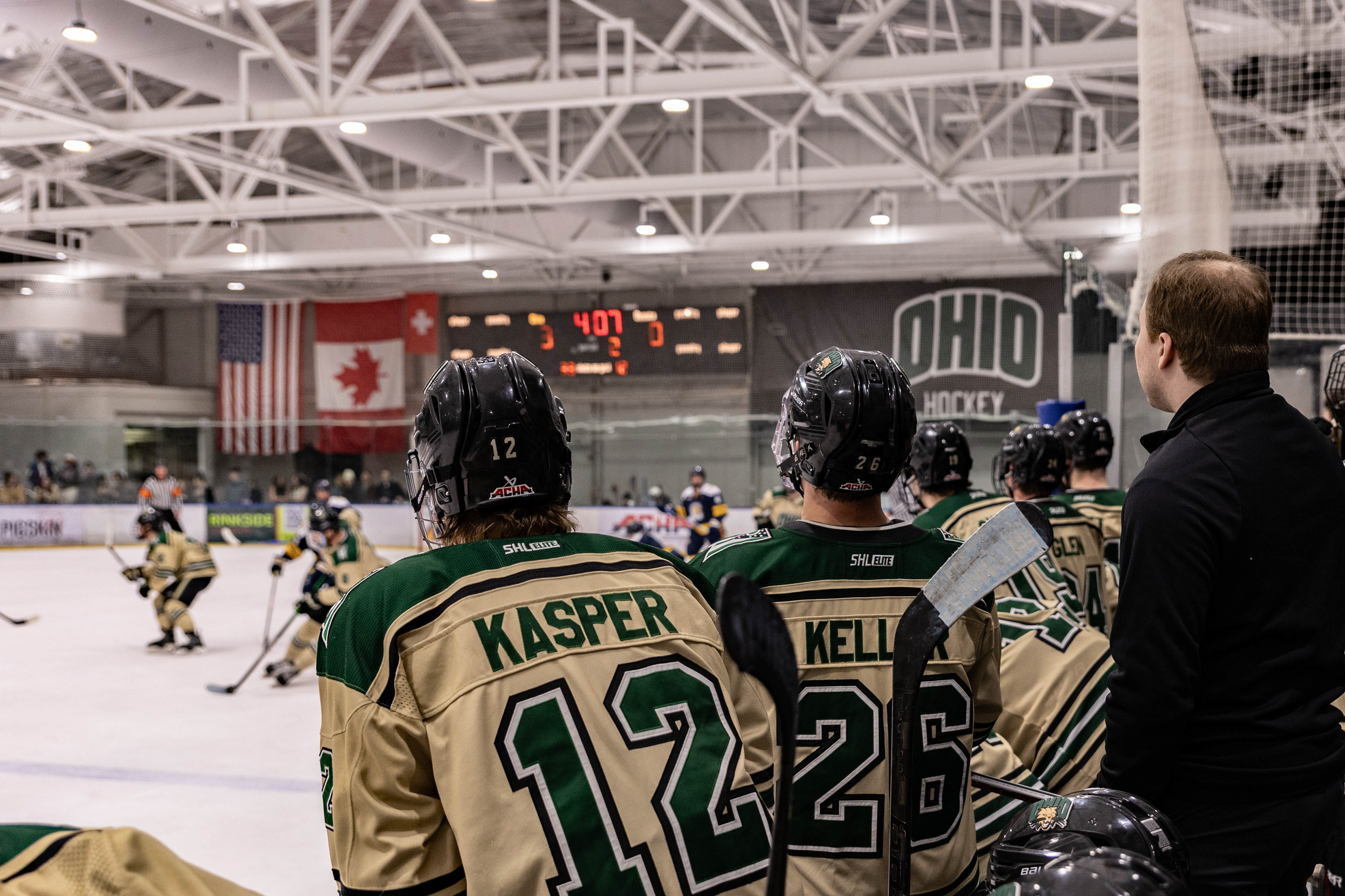 Assistant Coach Andrew Sacca and Bobcat players watch the game from the bench, Bird Ice Arena, Athens, Ohio, Feb. 6, 2026.