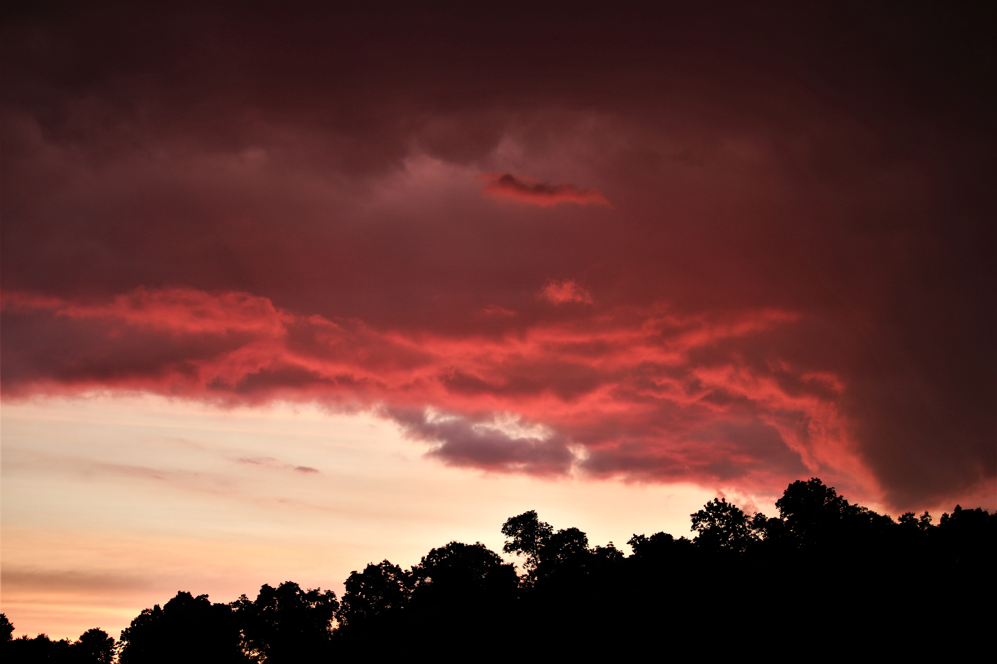 Pink clouds float in the sky one evening after storm June 15, 2020, Hamden, Ohio. This phenomena is caused by the scattering of shorter wavelengths and blue light.  