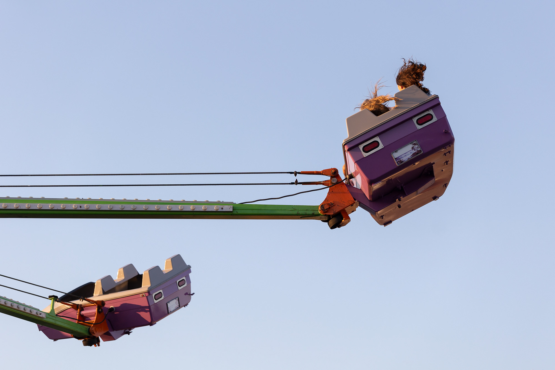 Two people on a ride together at the Jackson County Apple Festival in Jackson, Ohio, Sept. 22, 2023.