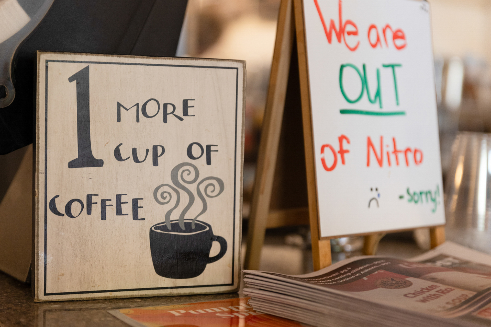 Various signs and decorations cover the countertops of Court Street Coffee. The decorations range from antique coffee grinders and radios to signs with coffee-related sayings on them. Karley Ackert, a barista at the coffee shop says, “I’m always so excited to decorate for the new season and I was finally able to pull out the Fall décor last week.”