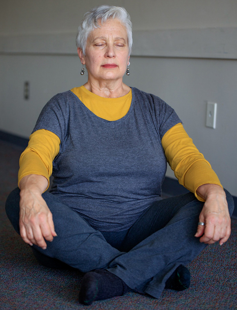 Soocan Palsa meditates during a Qigong workshop on Feb. 14, 2023,  at the Athens Public LIbrary on 30 Home St., Athens, Ohio. Qigong is an ancient Chinese practice that helps to awaken inner power, reduce stress, and connect to the universe for emotional well-being.