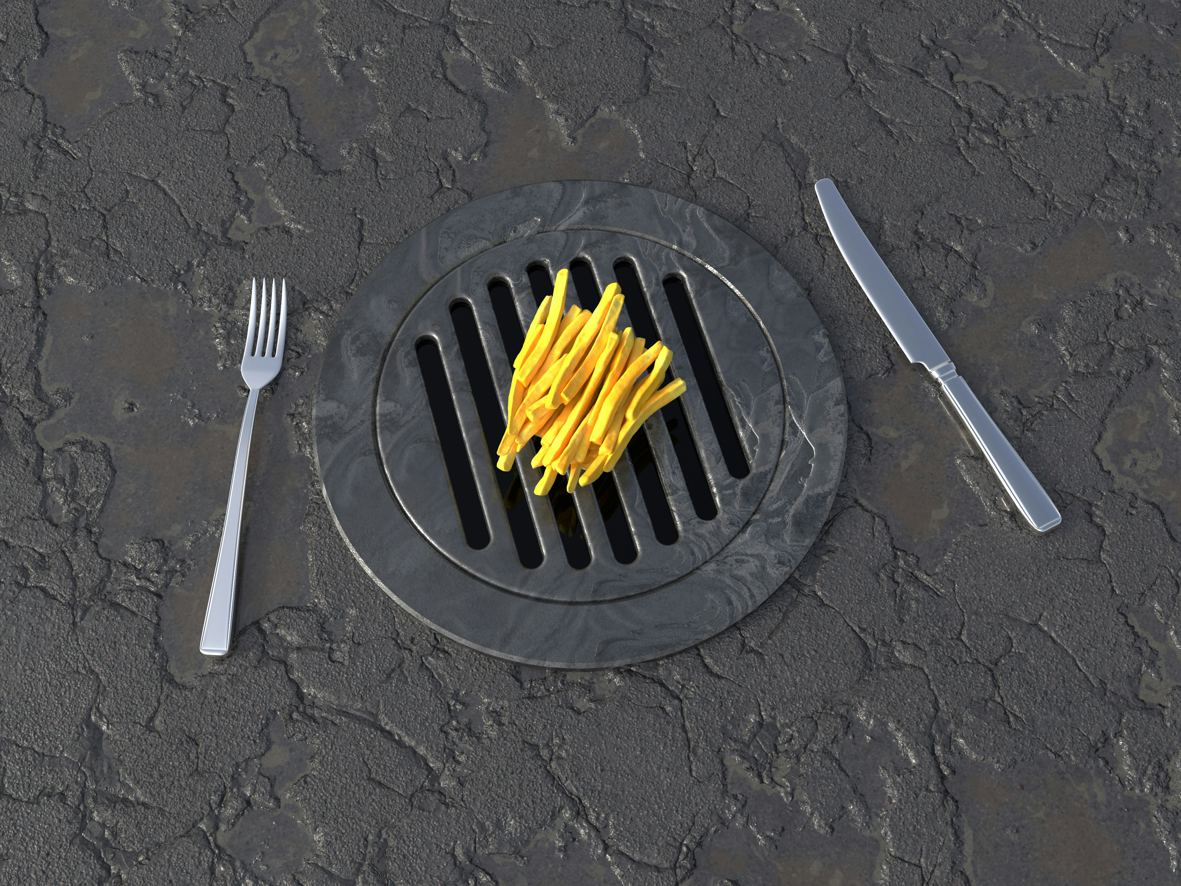 French fries with cutlery lying on a manhole cover / www.gastro-label.com