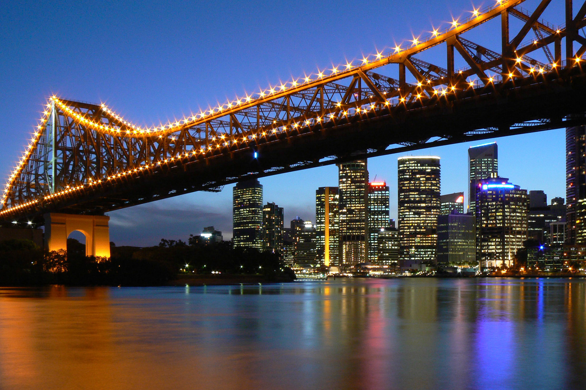 Brisbane CBD as seen from New Farm Riverwalk with Story Bridge over the Brisbane River in the foreground