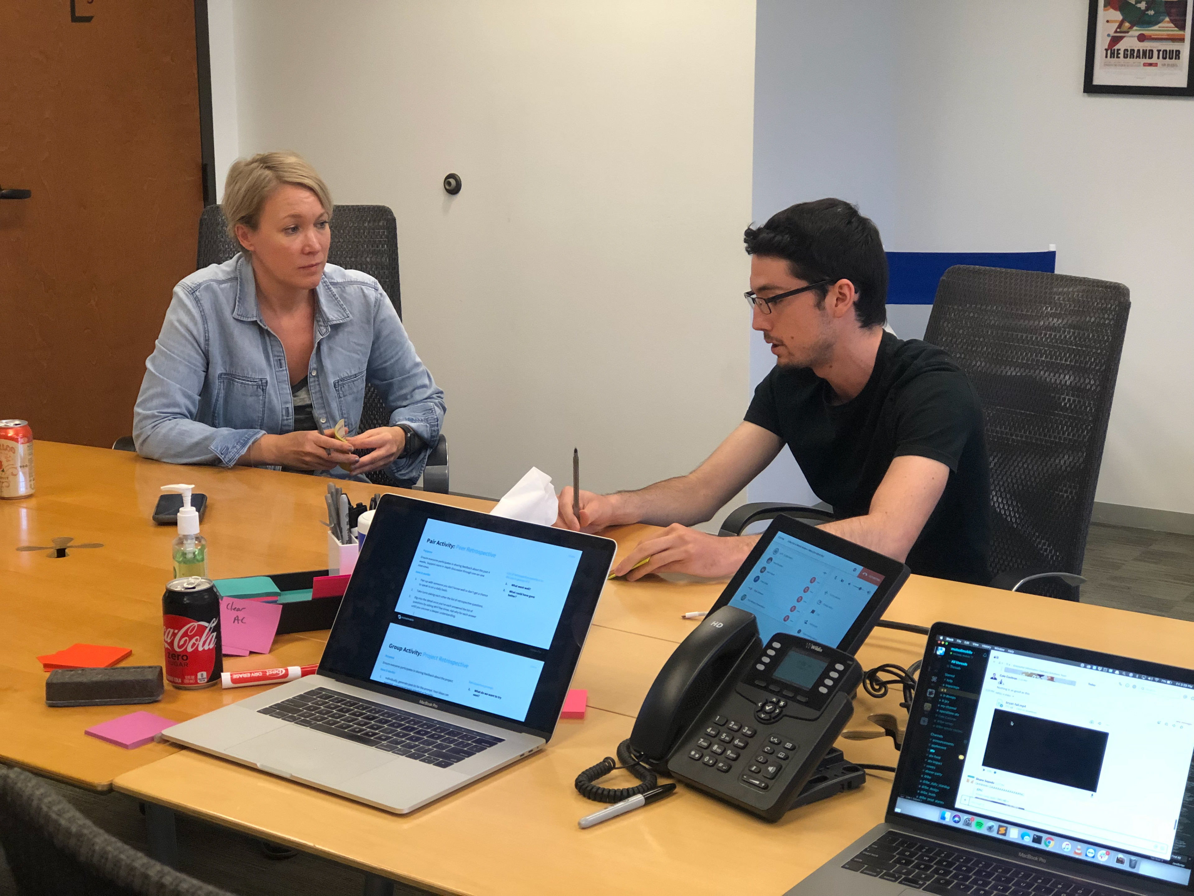 Creative Director leading design critique with a portal team member