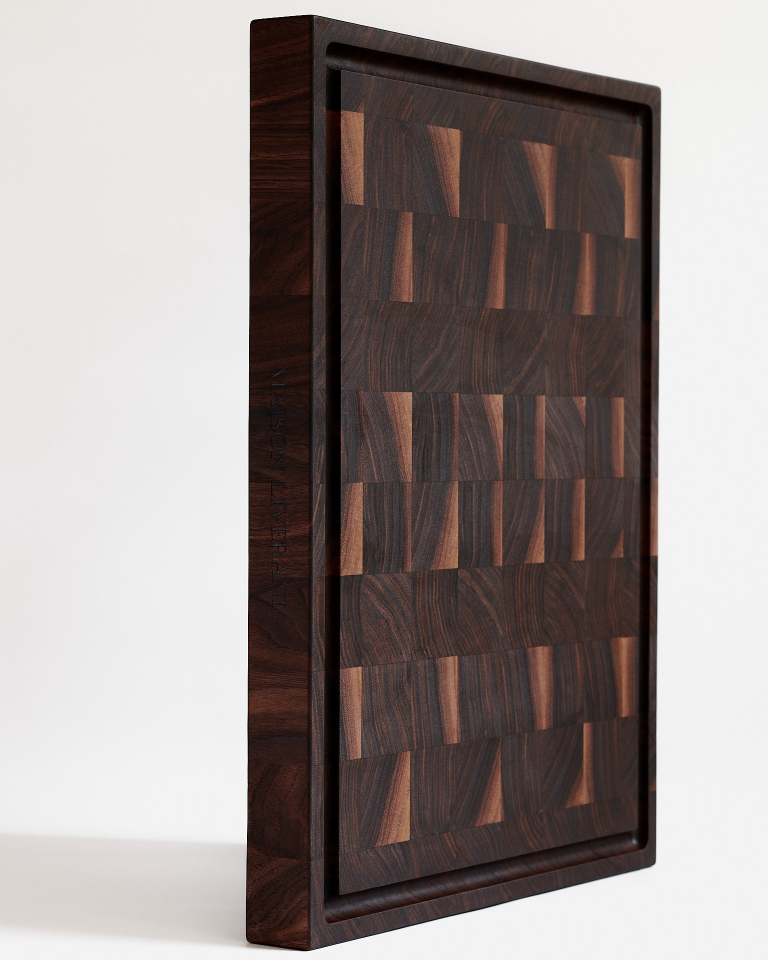 Artistic product photography of a standing walnut board, captured by Montreal food photographer Kata Endrodi