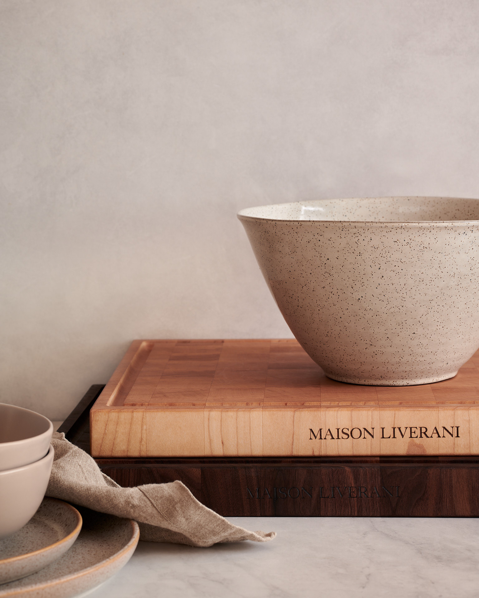 Kata Endrodi Montreal food and product photographer image with minimalist styling of wooden boards paired with a neutral ceramic bowl 