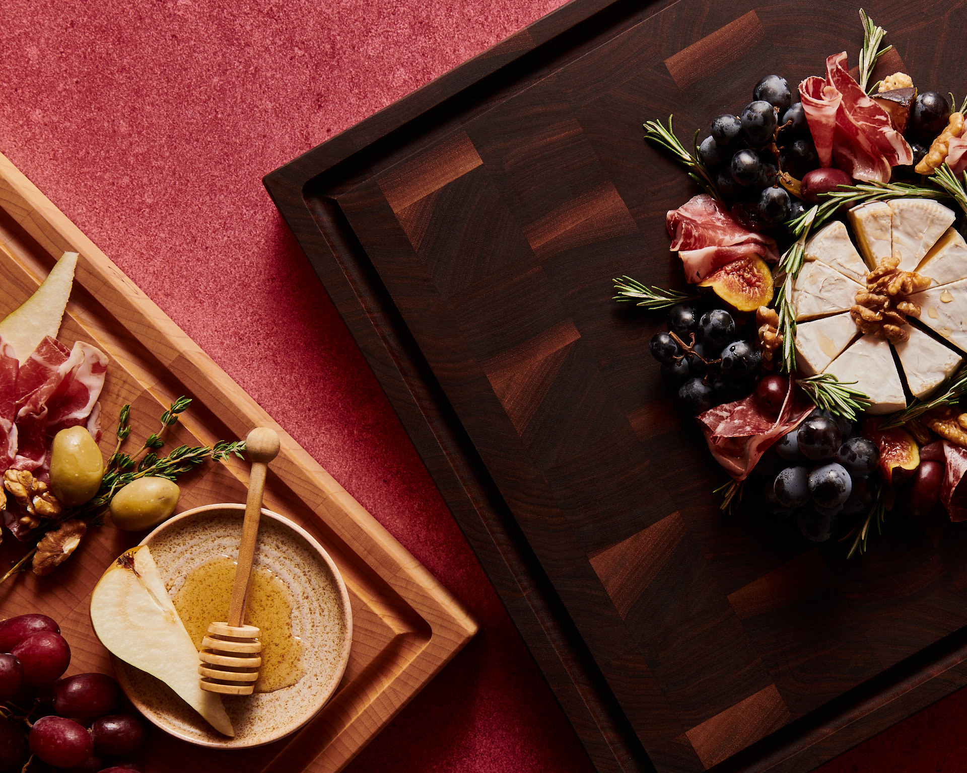 A product lifestyle photography festive food arrangements on two cutting boards with cheese, fruits and nuts, made by Kata Endrodi, a food and product photographer in Montreal