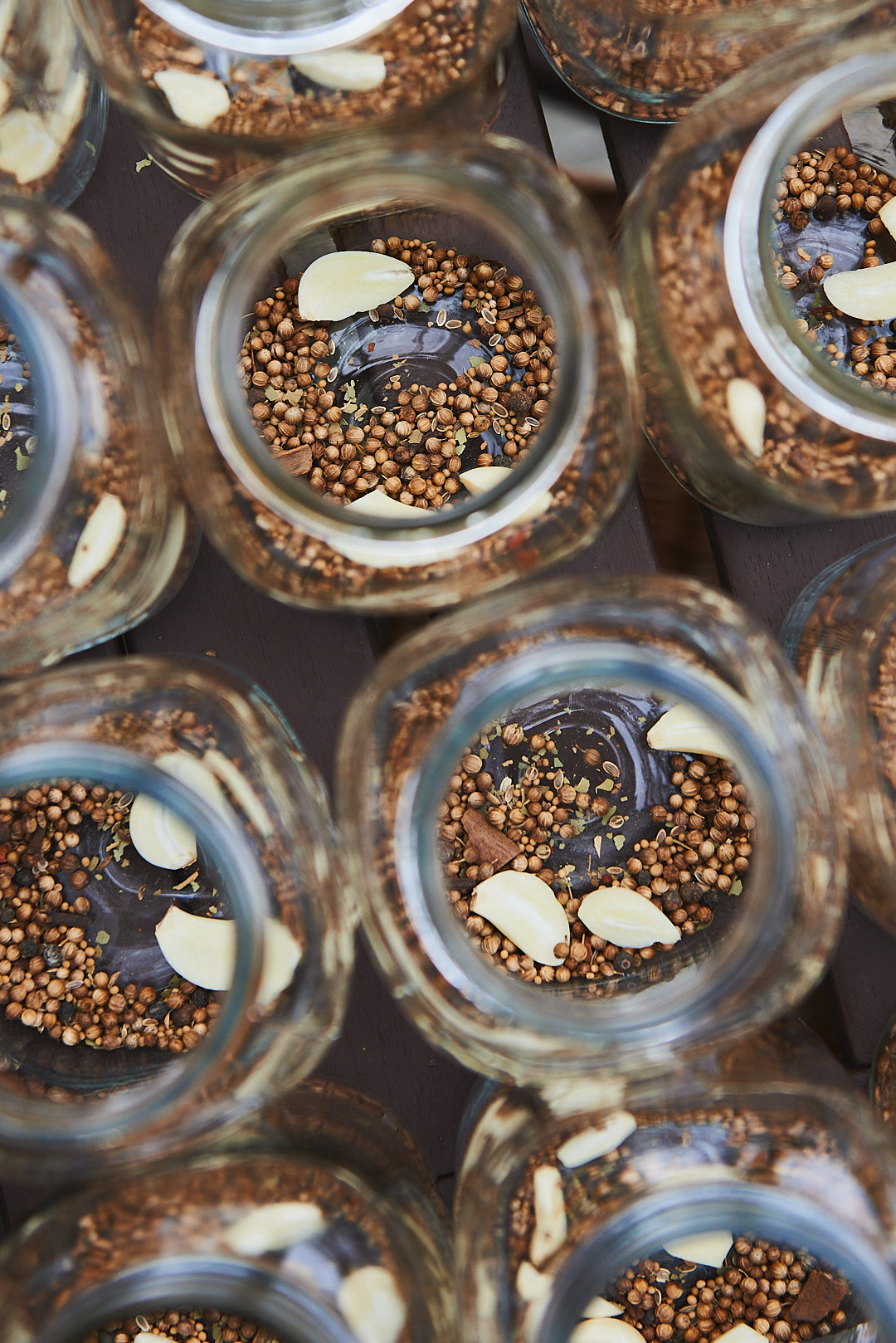 A food photography jars filled with spices and garlic for canning pickles, made by Kata Endrodi, a food photographer in Montreal