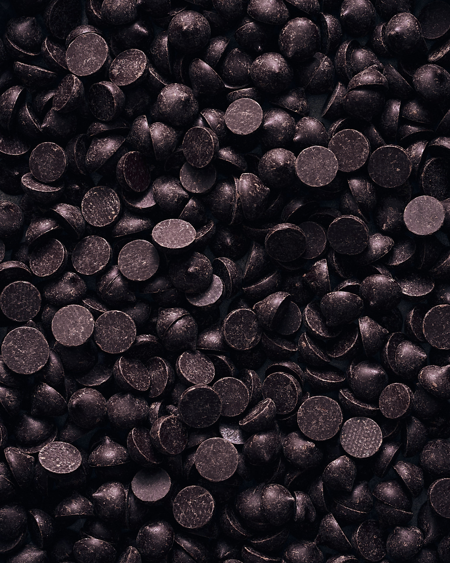 Macro food photography of dark chocolate chips and textures, captured by Montreal food photographer Kata Endrodi.