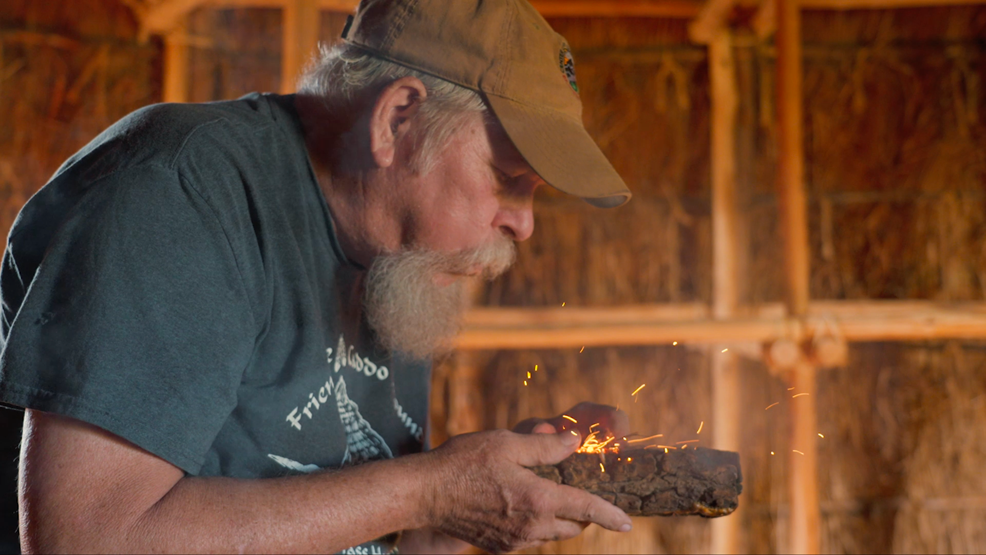 Neal Stilley starting a friction fire in An Ember of the Past, a documentary by Lone Bolt Pictures.