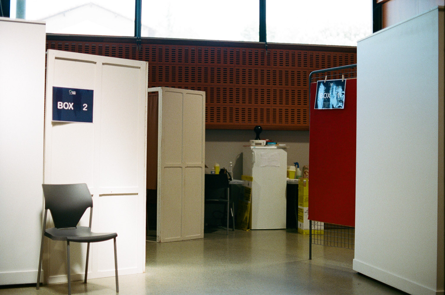 Each "box" allows privacy while the nurses administer the shots to the patients