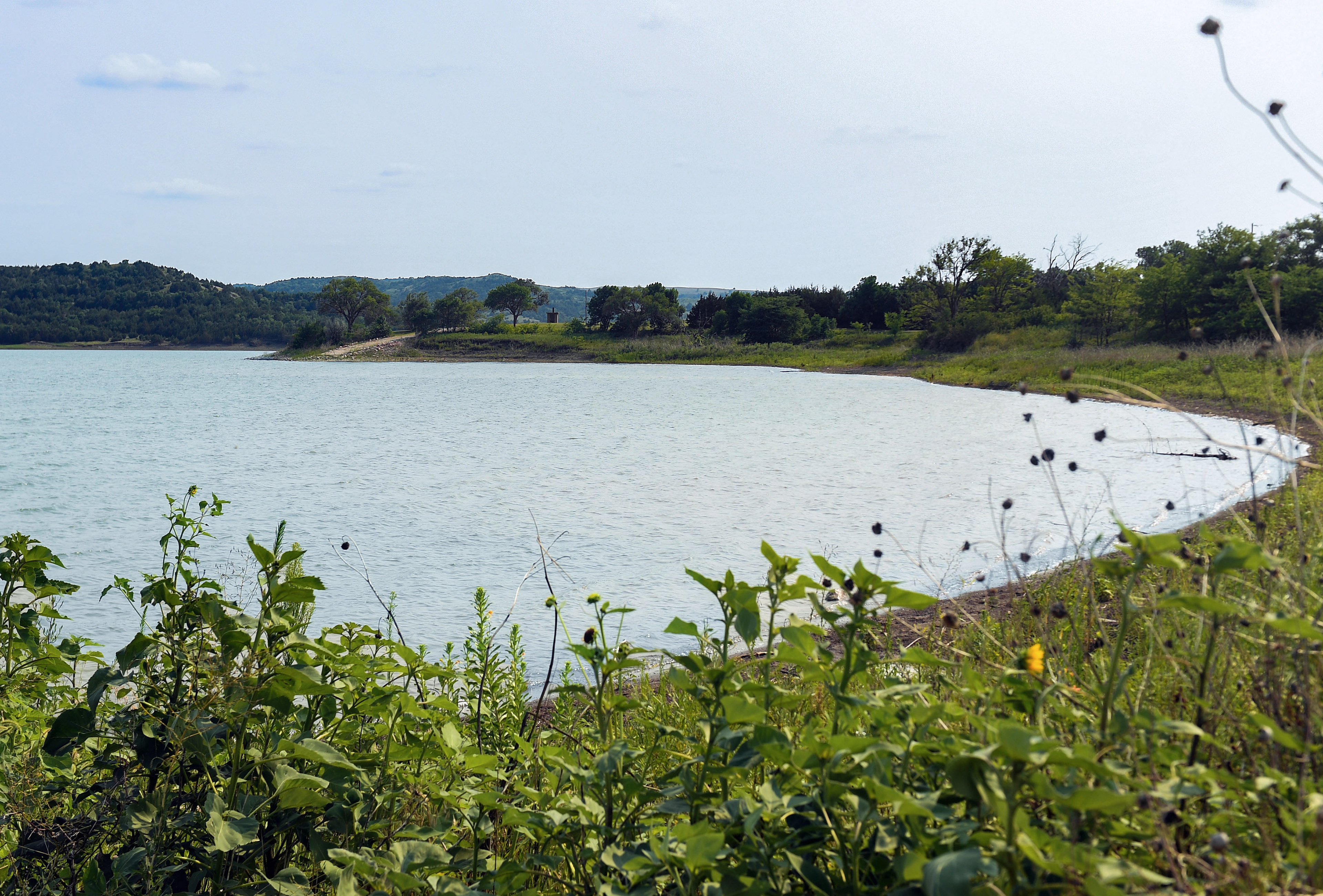 The water is quiet at Whetstone Landing, at the exact shore where Rosebud children were sent to Carlisle boarding school by steamboat over 100 years ago, on Friday, July 16, 2021 in Whetstone Bay.