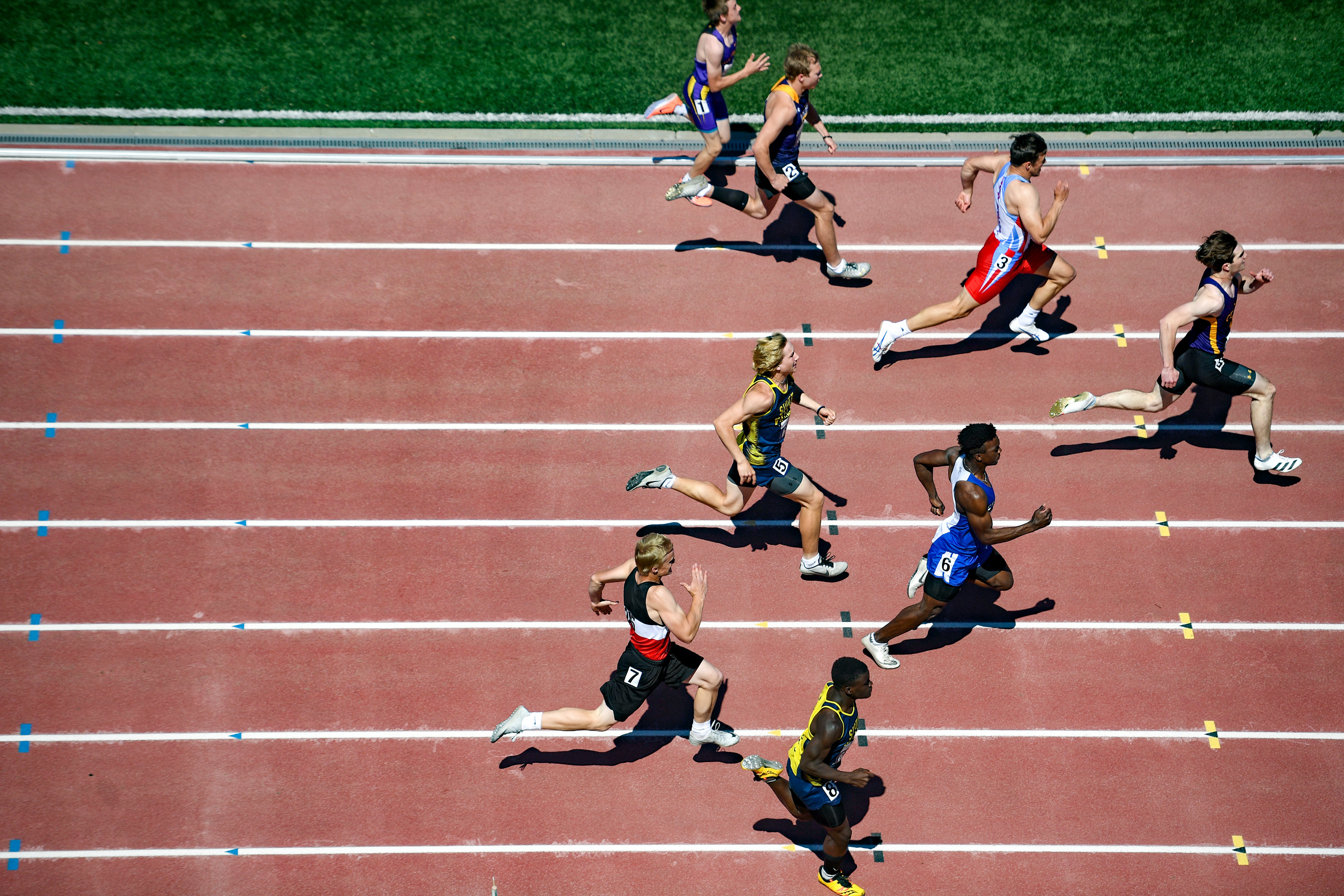 Boys compete in a preliminary heat for the class AA 100-meter dash during the first day of the state track meet on Thursday, May 26, 2022, at Howard Wood Field in Sioux Falls.