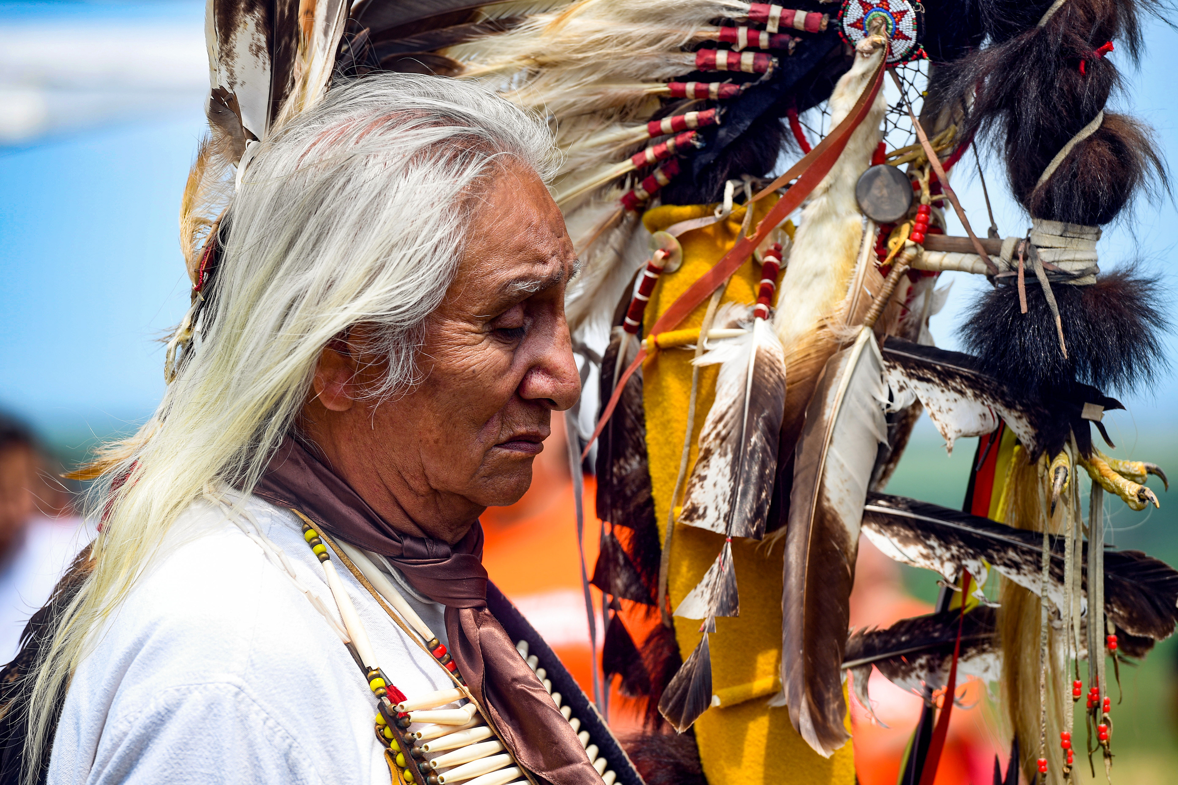 Tribal elder Duane Hollow Horn Bear listens to a speech at an event for the nine Rosebud children whose remains are being transported home on Friday, July 16, 2021 at the Fort Randall Casino on the Yankton Sioux Reservation. 