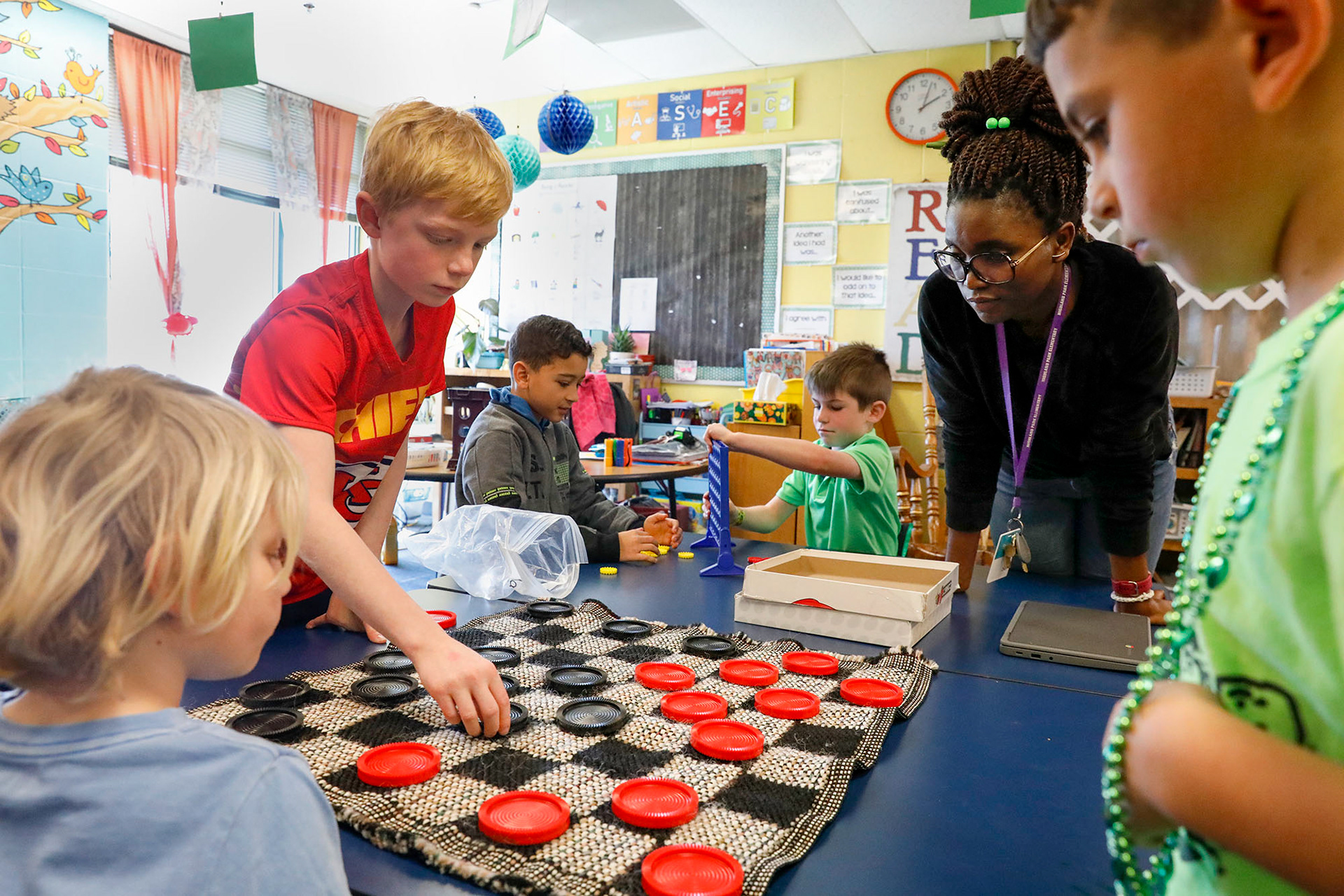 Tucker Reed, Tate Mayes and Saulo Reis participate in Board Game Club on March 15, 2024, at Highland Park Elementary.