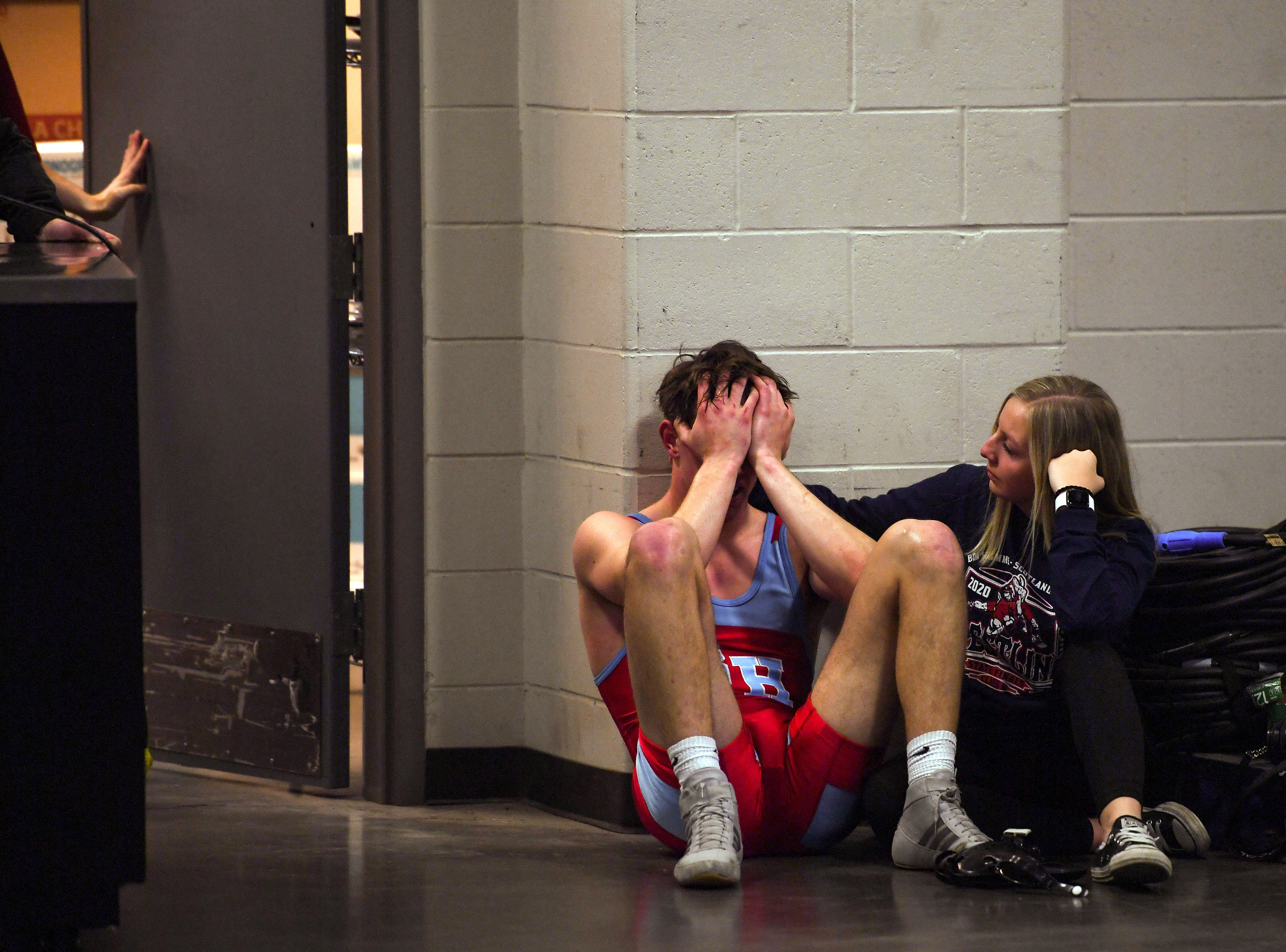 Bon Homme/Scotland/Avon's Josh Crownover is comforted in the hall after losing his match in the state wrestling semifinals on Friday, Feb. 28, 2020, at the Denny Sanford Premier Center in Sioux Falls.
