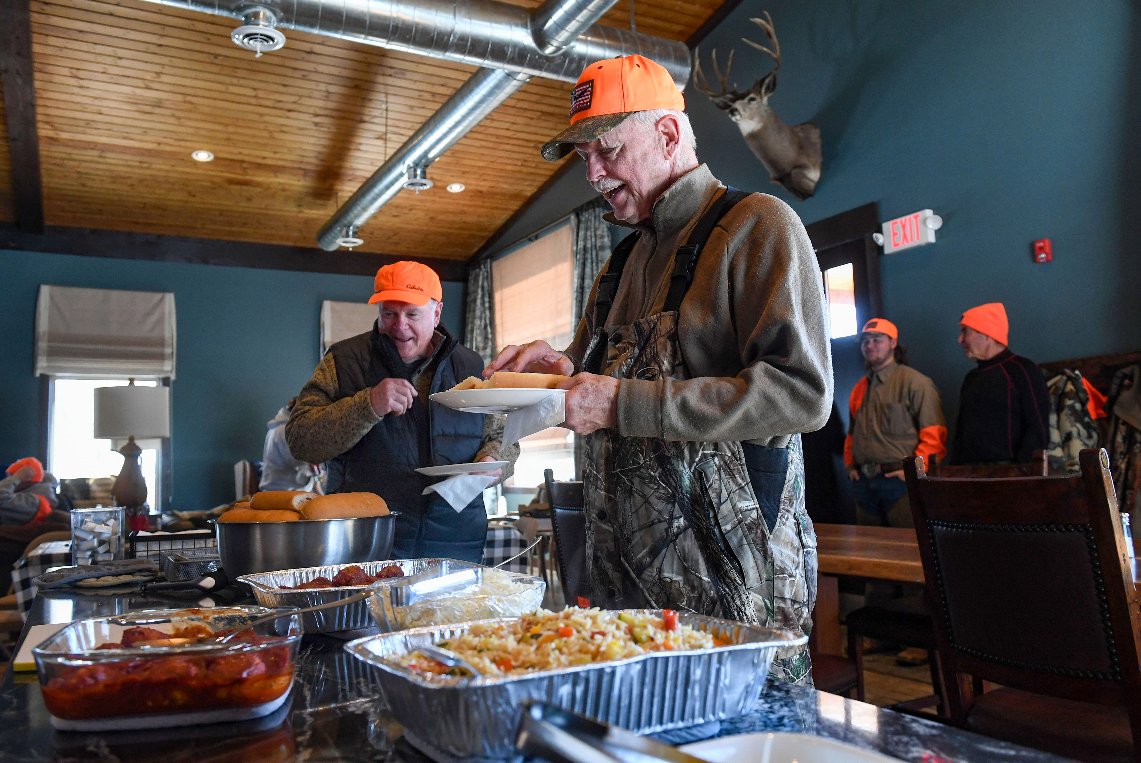 Terry Birchfield is the first in line for the lunch buffet after hitting the most clay targets during practice that morning on Friday, February 17, 2023, at a Wings of Valor retreat in Parker, SD.