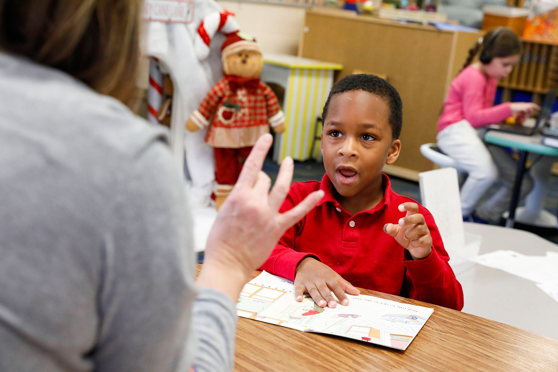 Kindergartener Carlton Weathers practices reading and sounding out words on December 14, 2023, at Greenwood Elementary.