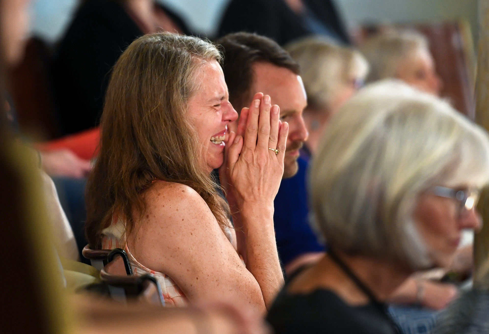Jenny Boever, widow of the deceased Joe Boever, simultaneously smiles and cries after the Senate votes to  convict Attorney General Jason Ravnsborg on both articles of impeachment on Tuesday, June 21, 2022, at the South Dakota State Capitol in Pierre. Ravnsborg struck and killed Joe Boever with his car on a highway in 2020.