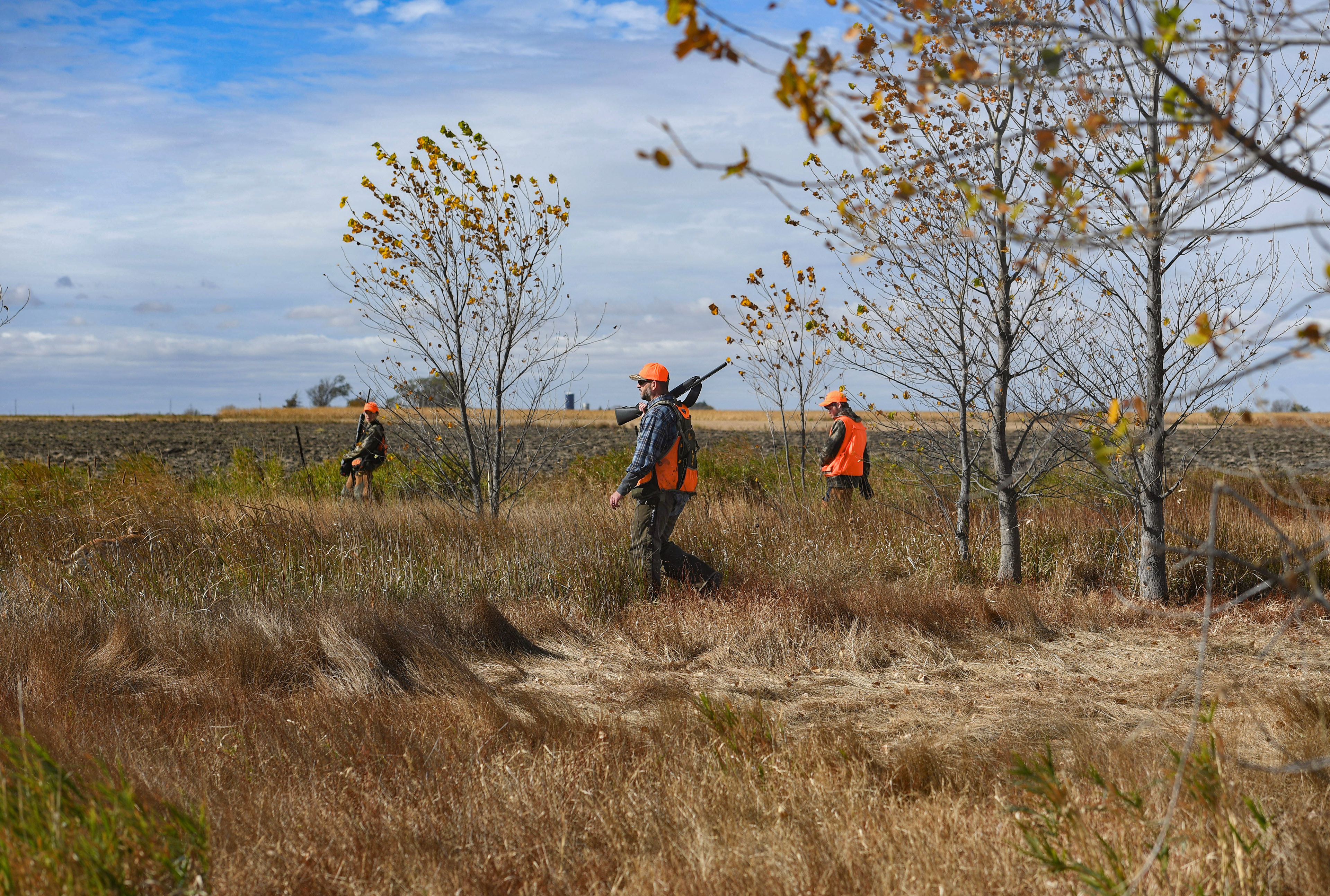 Andrew Johnson, his son Gavin and stepson Noah Watson walk through wildlife habitat land created by Johnson’s friend, the late Steve Bierle, during the pheasant season opener on Saturday, October 17, 2020 near Olivet, South Dakota.