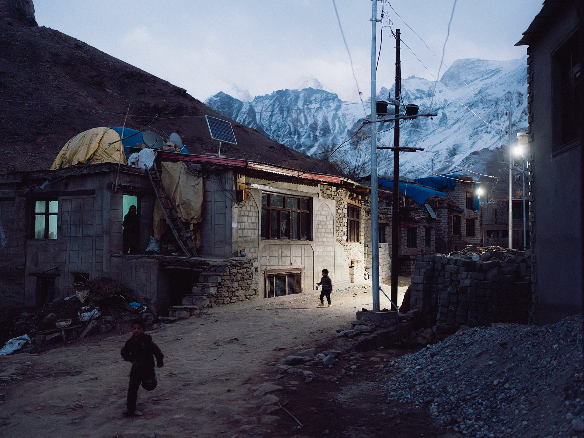 The village of Tongole is around halfway between Kargil and Zanskar and is soon to be connected by NH 301. Every winter, the village gets cut off due to heavy snowfall, so each house is preparing during some of the year's first snowfall.
