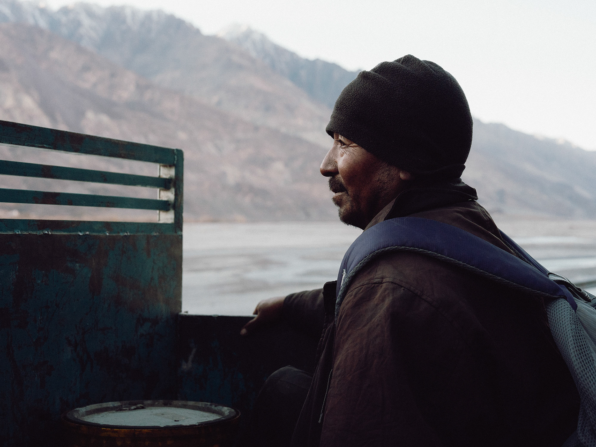 Muktu on the bed of a pickup truck, hitching a ride from Panamik towards Tiricha, Nubra Valley