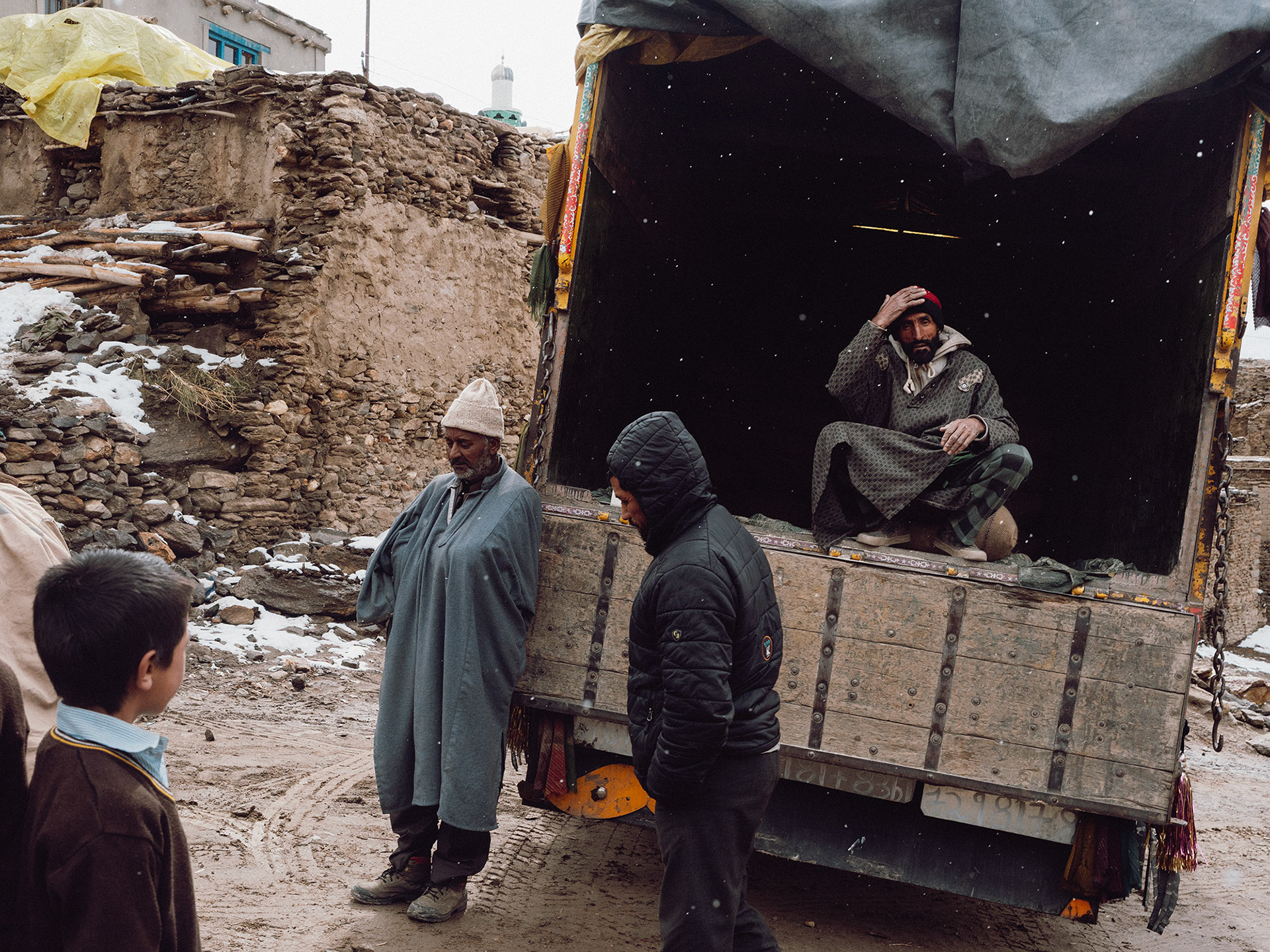 A truck delivering flour to the people living in the small village of Parkachick during a light snowfall. Later in winter, when the snowstorms move in, the trucks might not be able to deliver anything.