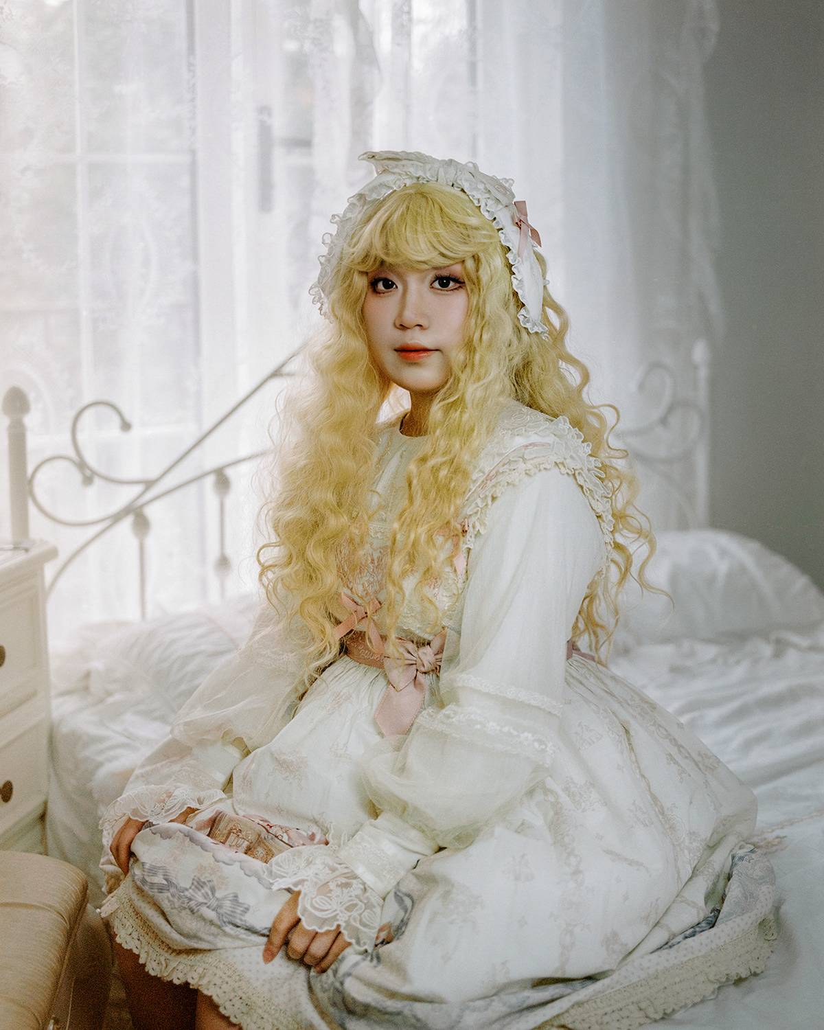 Cha You. Cha You is currently in her third year of high school. She developed a liking for Lolita fashion back in her second year of junior high. Faced with academic pressures, the joy of wearing a Lolita dress for the first time momentarily eased her stress. Since then, she's regarded Lolita as a form of reward. For every memorable moment in her life, she rewards herself with a new Lolita dress. She prefers dresses that have a narrative design, where the patterns resonate with her inner self, symbolizing how different traits construct a complete version of herself. She reached out to me to make photos of her with Lolita, hoping to commemorate her 18th birthday with them.