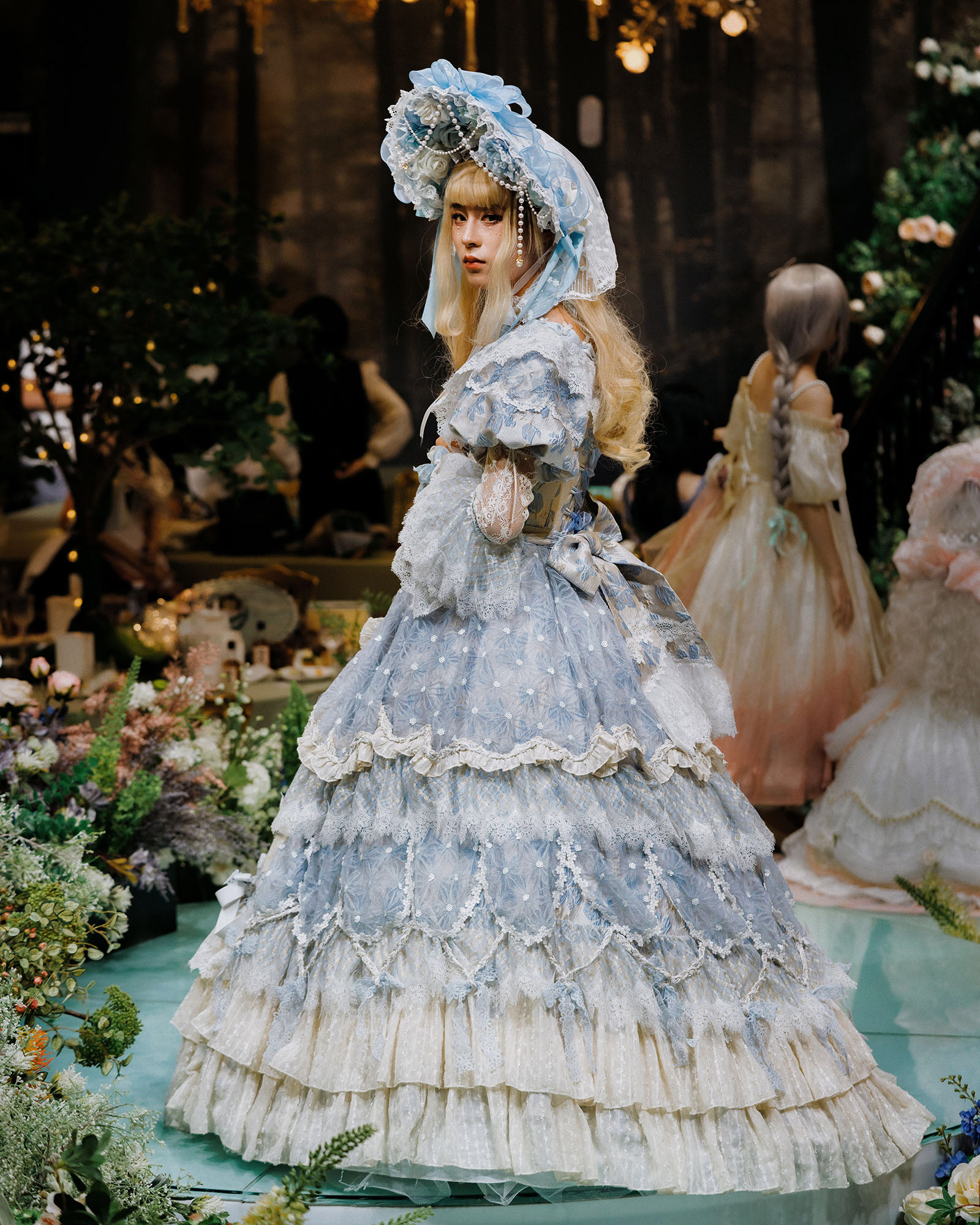 Lin Er. Lin Er is a male Lolita enthusiast. Men have always been a niche presence in the Lolita scene. Although there is a small amount of Lolita clothing for men, most of the time they also wear female Lolita dress. They are often seen as an anomaly both inside and outside the community. For various reasons, Lin Er rarely wore women's Lolita clothes after he started working. I took this photo of him in full costume at the largest Lolita tea party in Chengdu.