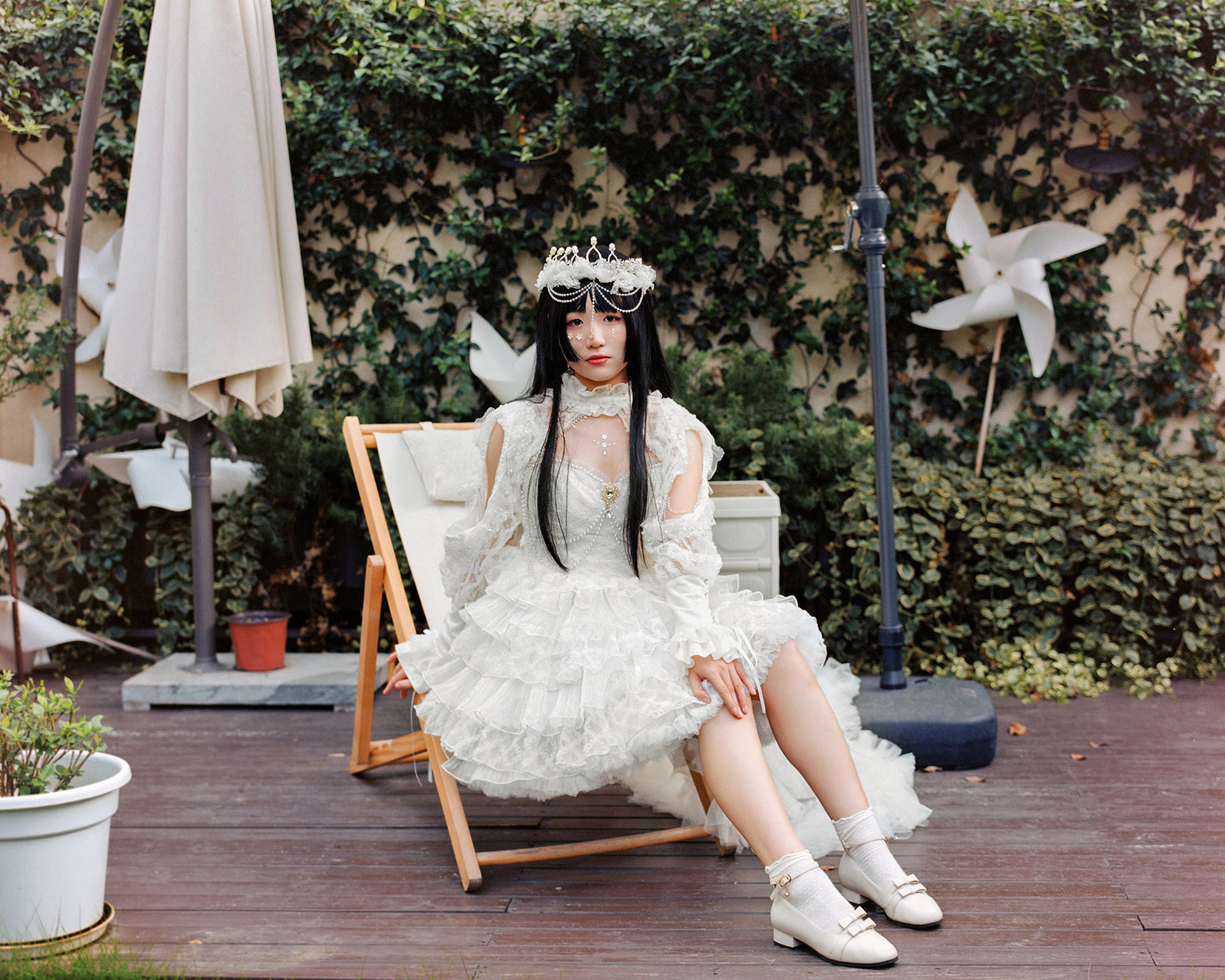 Li Li. Li Li is a photographer of the Lolita community and she is also a fan of Lolita fashion. She usually wears a Lolita dress when she takes pictures. I took this picture when she was working as a photographer for a Lolita party.