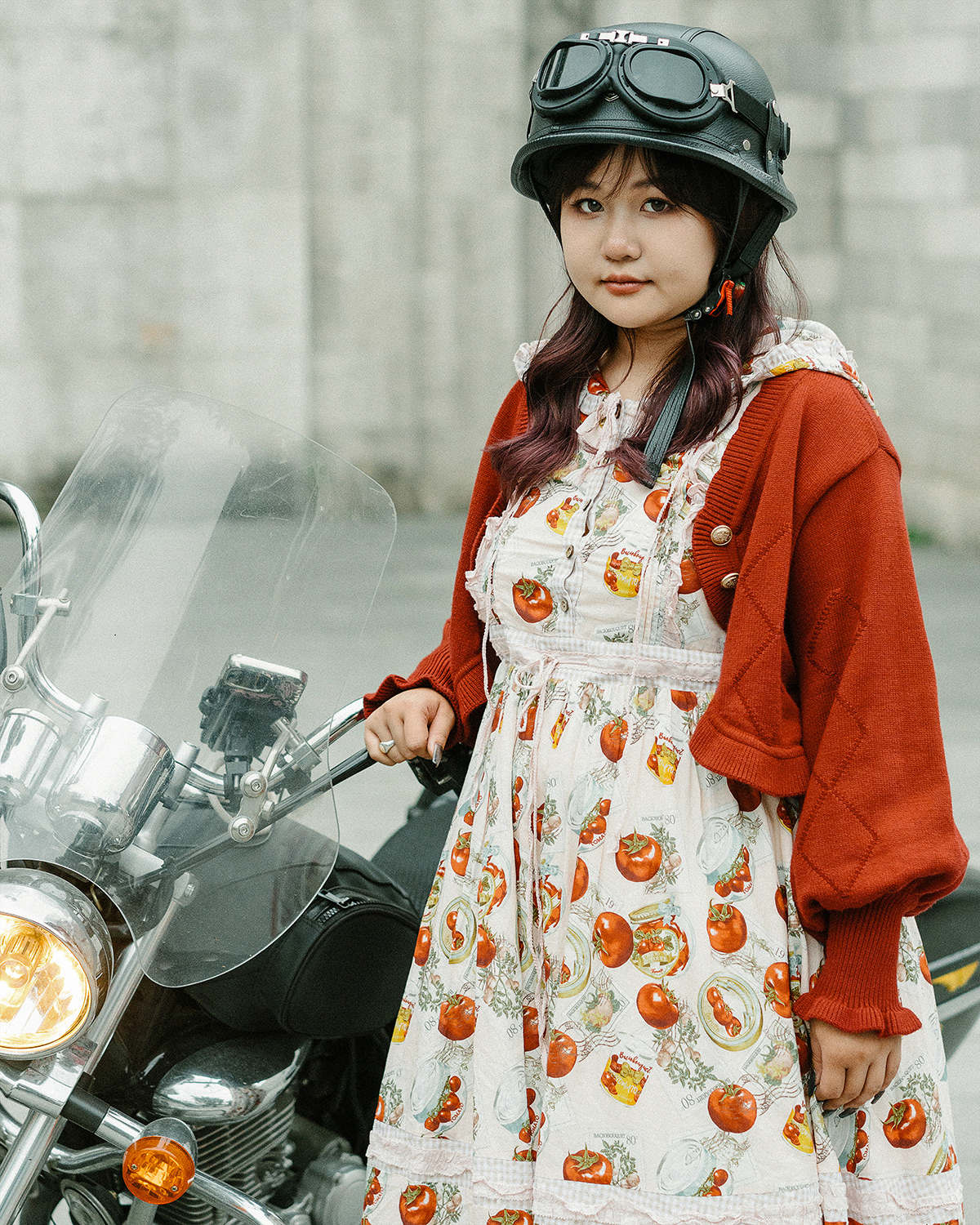 Xiao Fu. Xiao Fu began embracing Lolita fashion around 2016 and currently works as a teacher. Lolita has seamlessly integrated into her life, and she enjoys experimenting with various accessories to complement her outfits. Wearing these distinctive dresses attracts more attention, and as urban culture becomes increasingly inclusive, the majority of the attention she receives is positive. These affirming responses have contributed significantly to her growing self-assurance. Additionally, she owns a large motorcycle, which she uses for her daily commute. I made a portrait of her alongside her motorcycle.