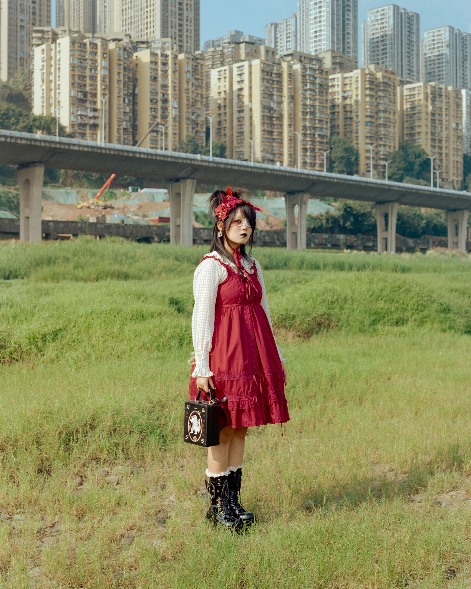 KillerTiger777, 2024. KillerTiger777 has loved Lolita fashion for over a decade. After completing her studies and work in Beijing, she returned to her hometown, Chongqing. Now a freelancer, she balances roles as a doujinshi illustrator, Lolita model, and subculture photographer. She enjoys gothic-style Lolita and creatively combines Lolita with other subcultural styles. Reflecting on the current state of the Lolita community, she notes that its expansion has attracted a broader audience but has also diluted its subcultural essence, leading to changes that don’t fully align with Lolita’s original spirit.