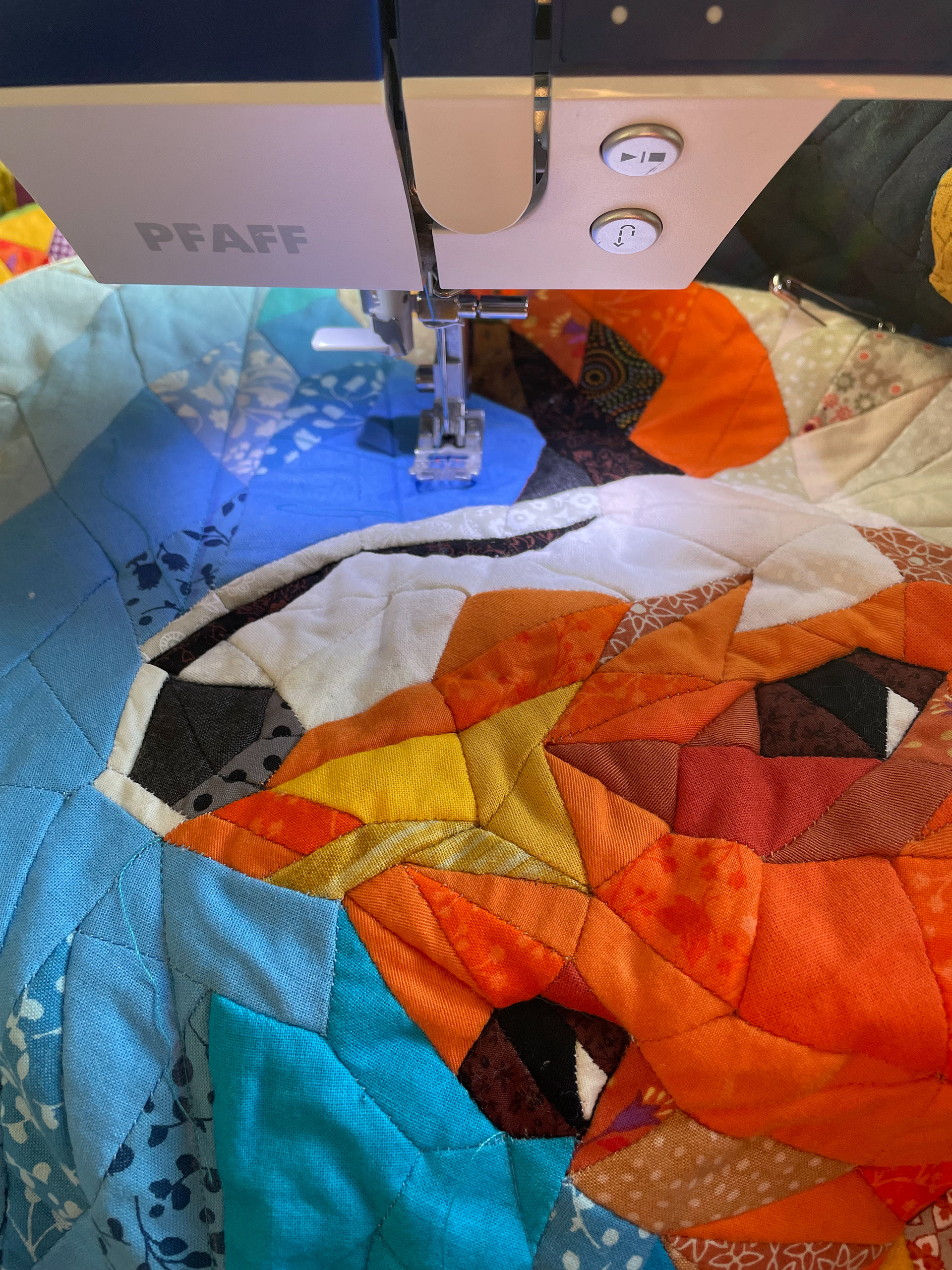 close up of stitching irregular epp patchwork pattern with sewing machine.