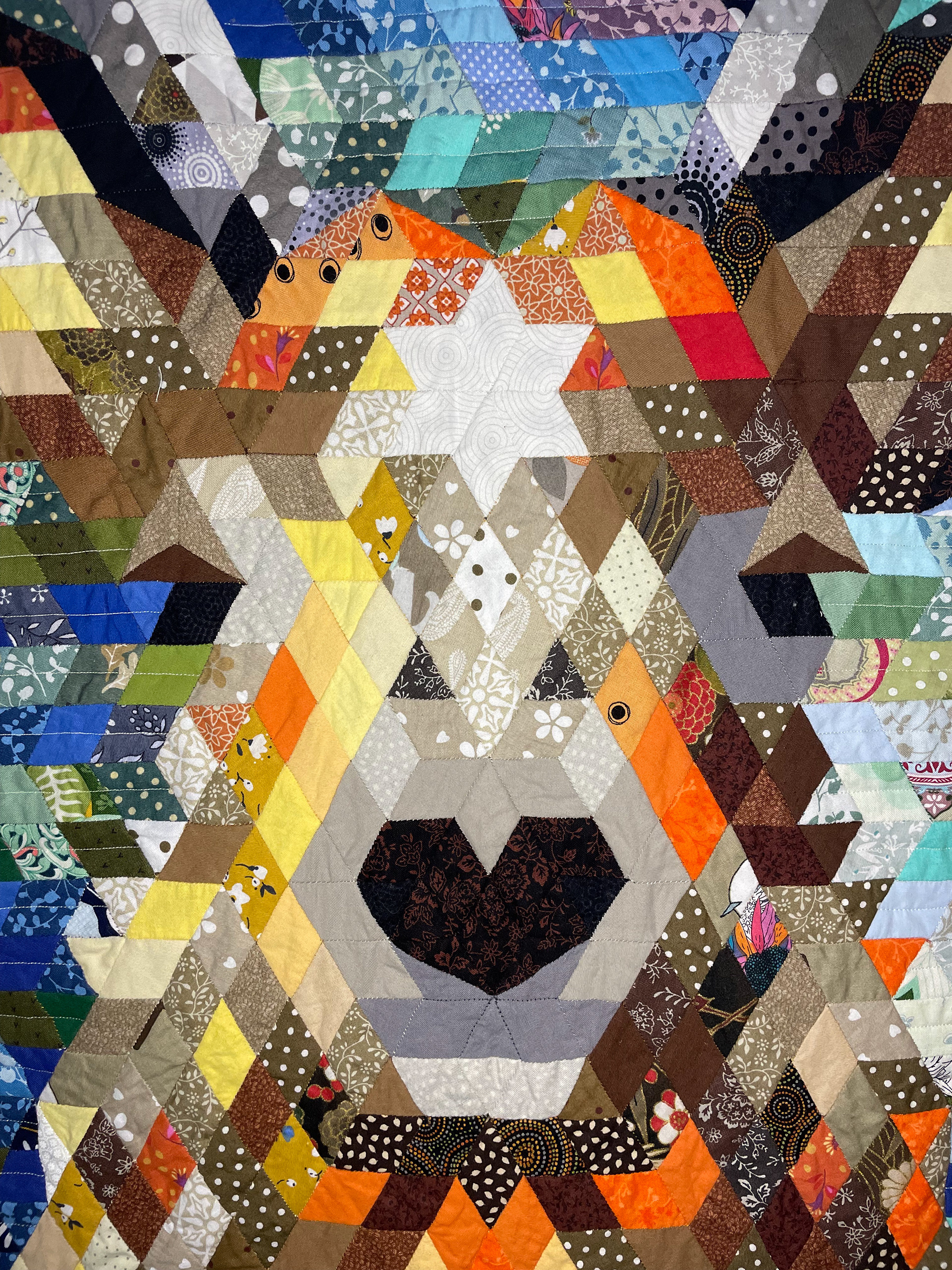 Close up detail of epp diamonds patchwork pattern of a stag.