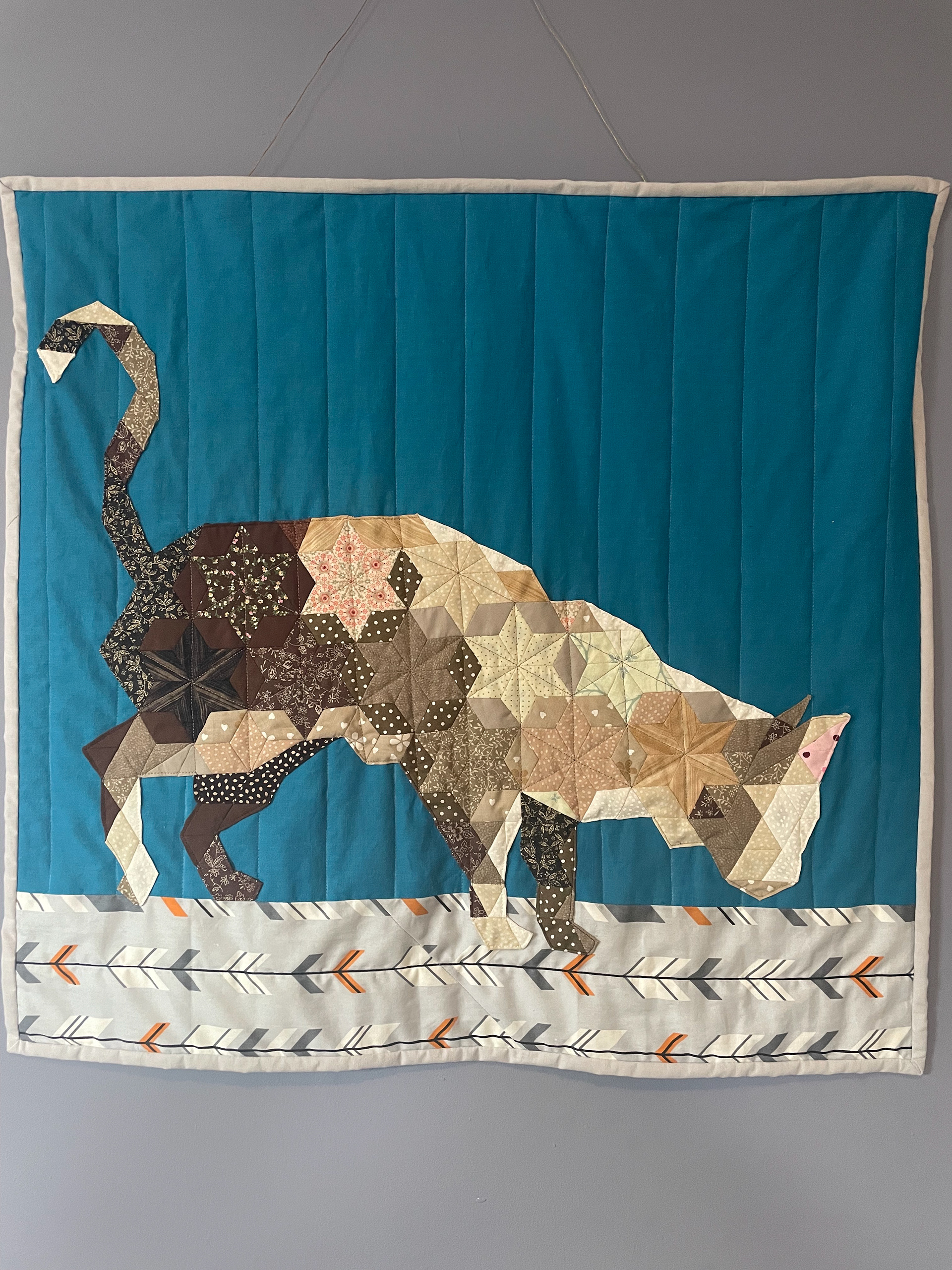 EPP wall hanging of a curious cat