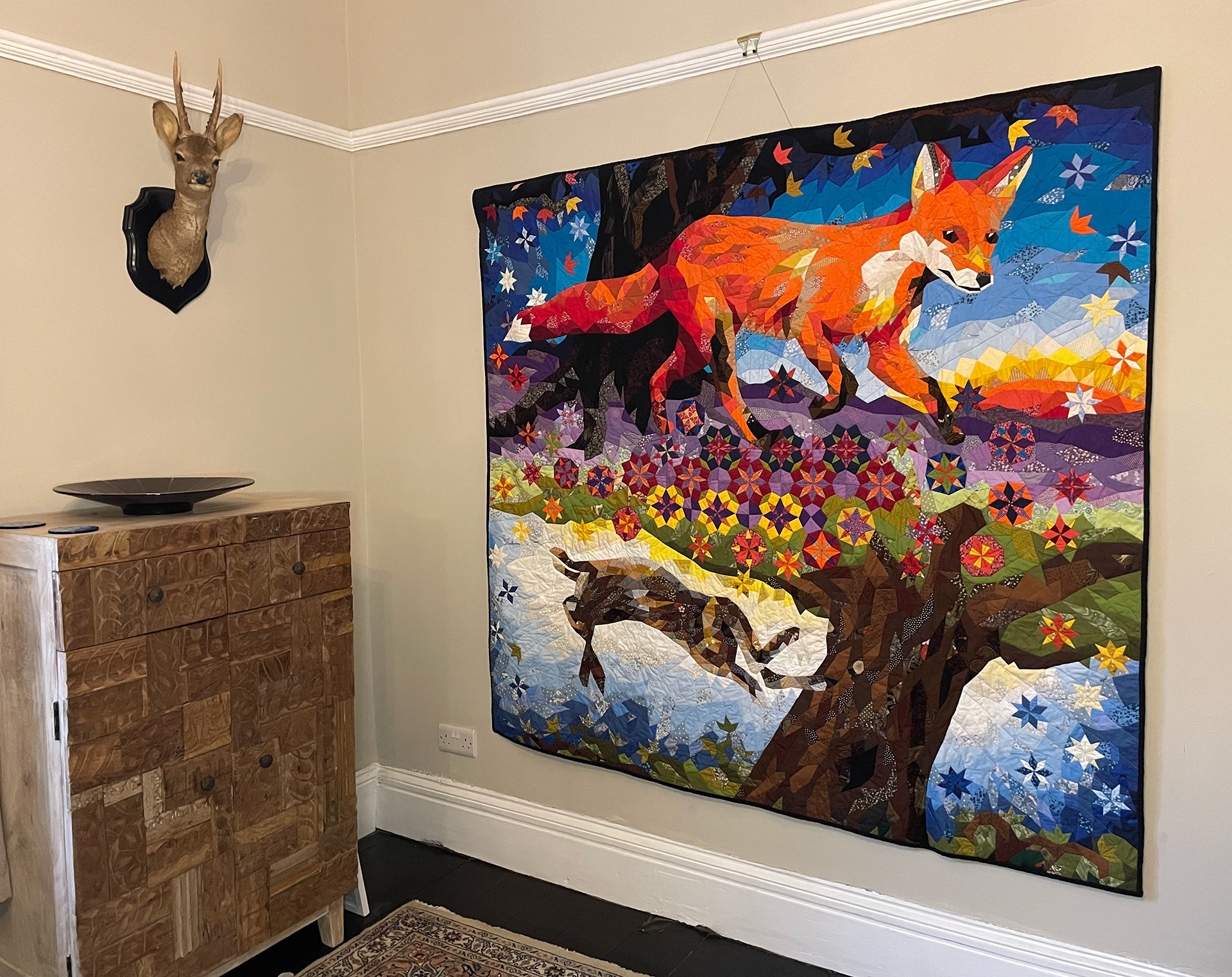 patchwork forest with fox and hare wall hanging