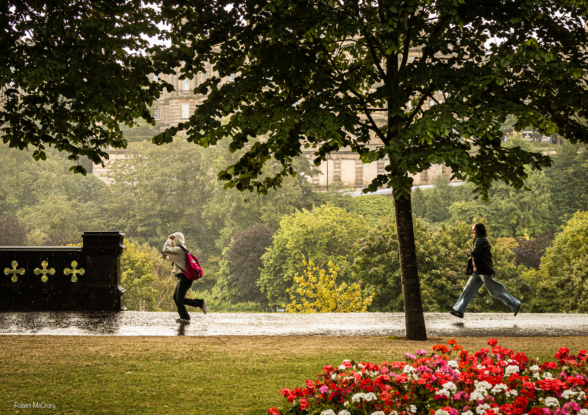 Running in the rain, Princess Street Gardens, Edinburgh, Scotlands capital city