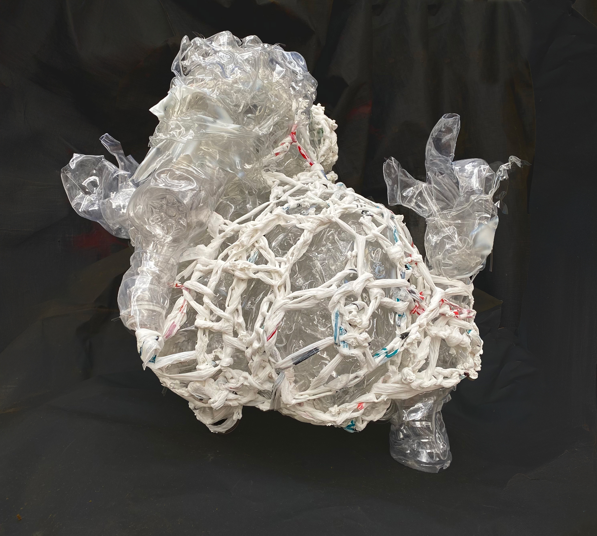 Low Signal, 2025, Reclaimed plastic containers, plastic shopping bags, 24” x 25” x 24”