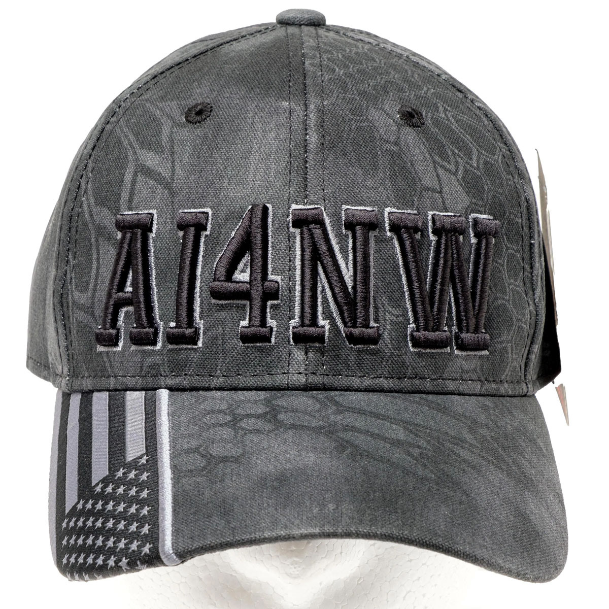Gray Kryptek ham radio call sign hat with AI4NW black 3D puff embroidery and American flag brim detail.
