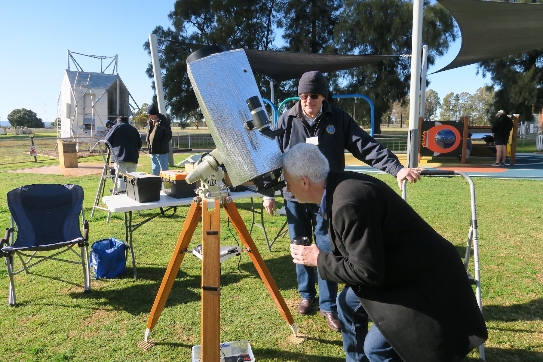 Dr John Reynolds admiring Venus through Laurie Crowley's telescope.