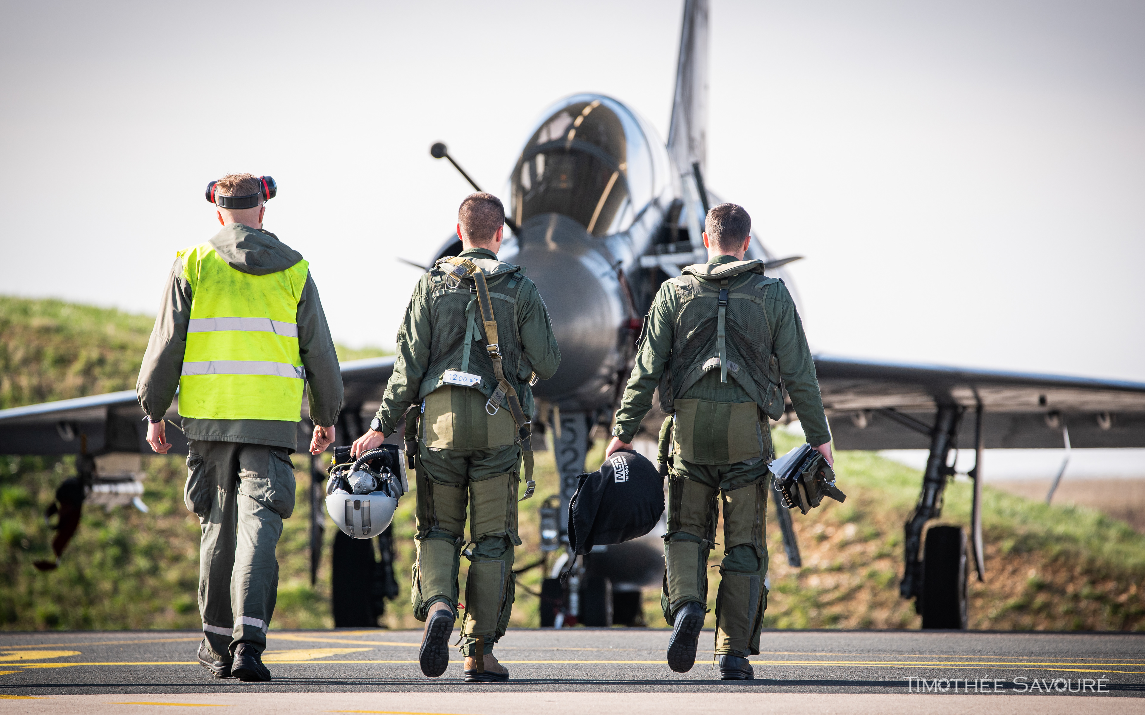 2/3 Champagne instructor and student pilot leaving for a training flight