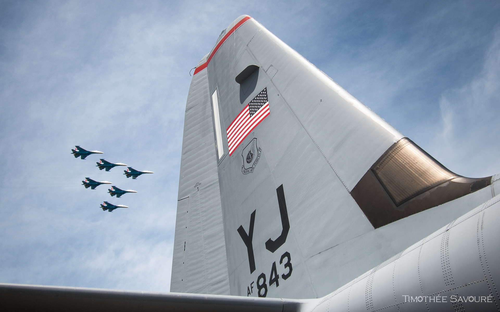 Unusual shot with a US Air Force C-130J tail and the Russian Knights Sukhoi Su-35 in flight