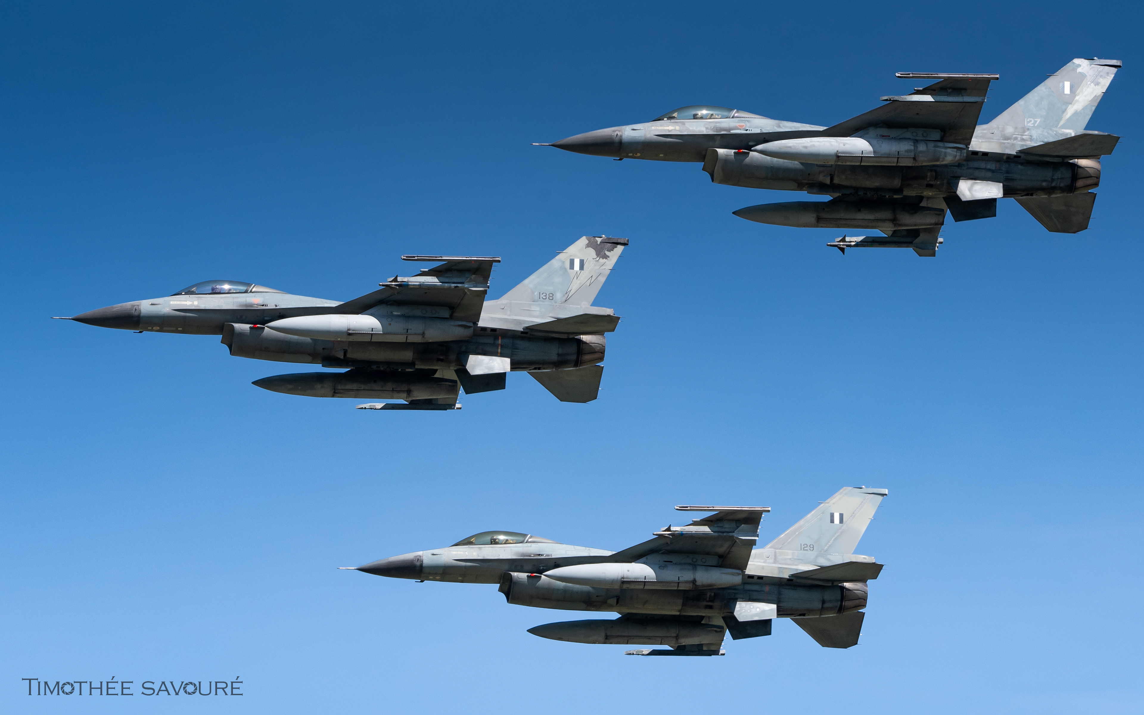 A trio of Hellenic Air Force F-16C from nearby Araxos AFB flying over Andravida