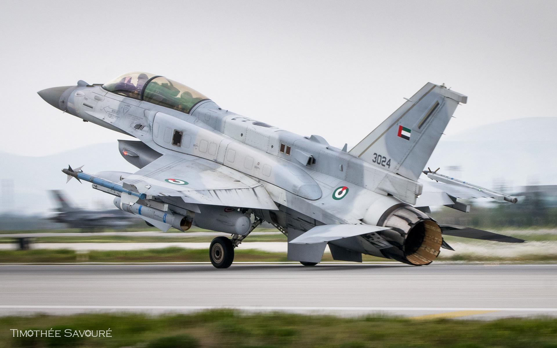 UAE Air Force F-16F landing (notice the engine nozzle making sparks on the runway)