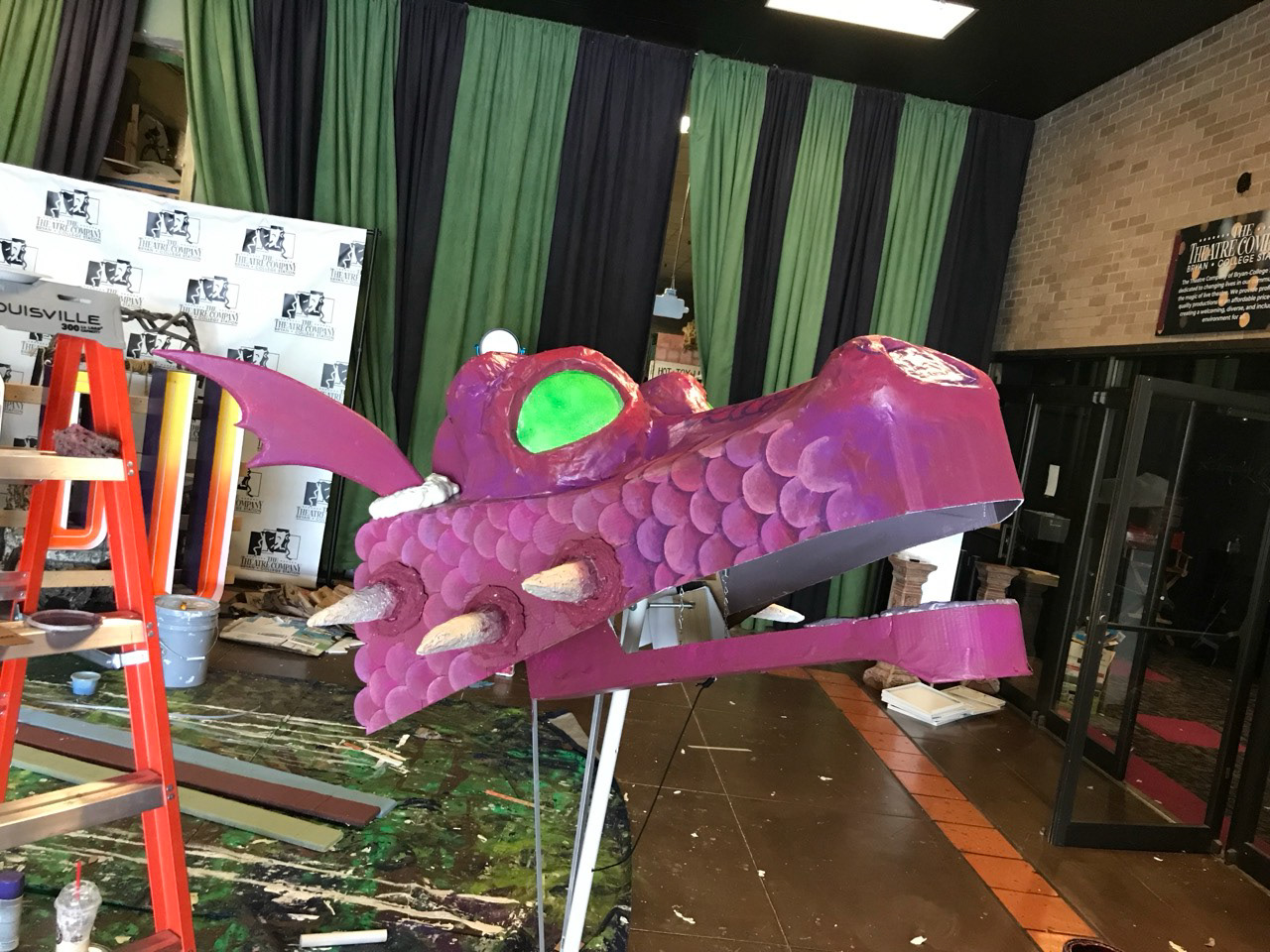 Painting scales and adding foam horns and ears
